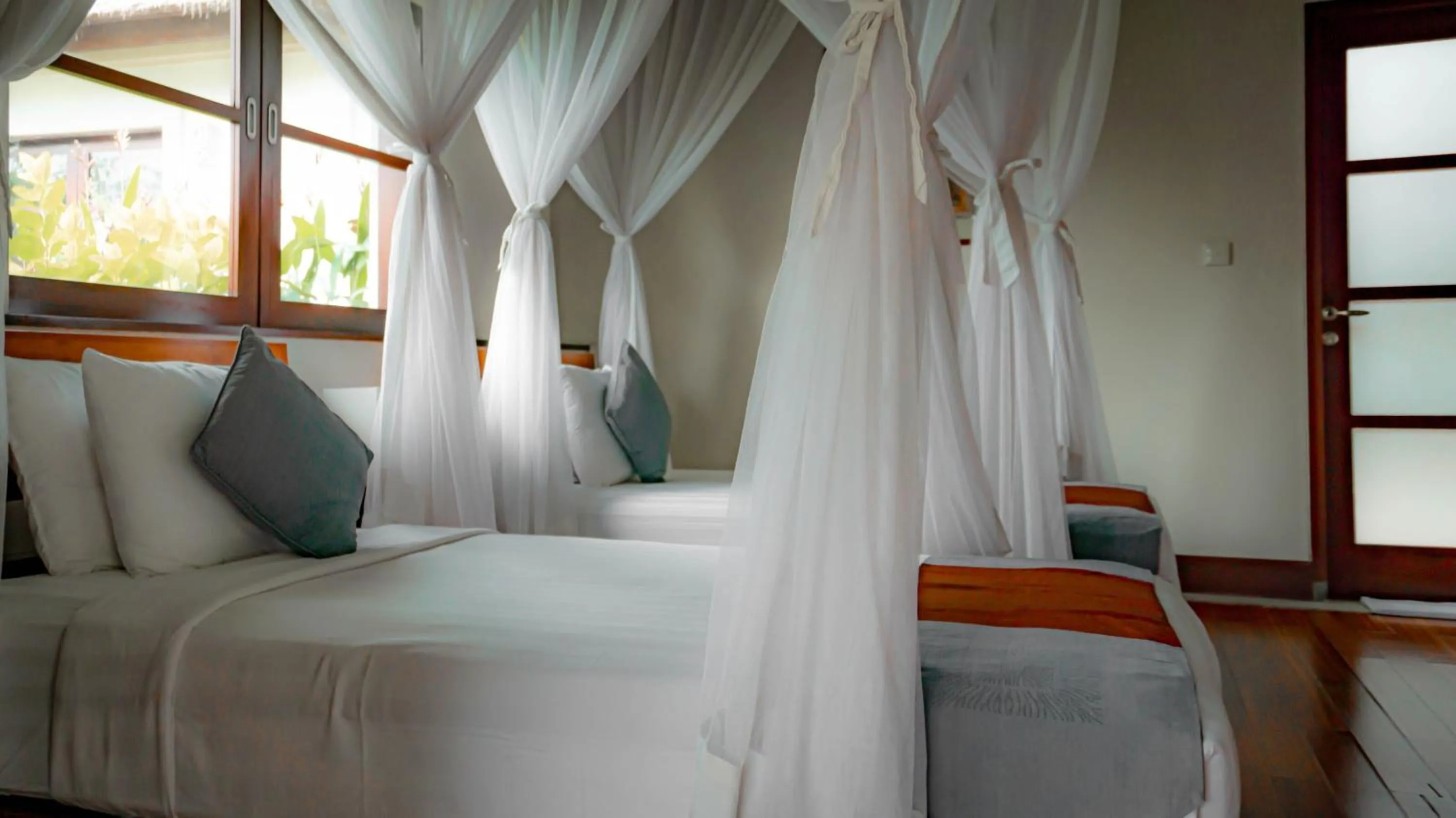 Bed in The Lotus Residence by Amerta Experience