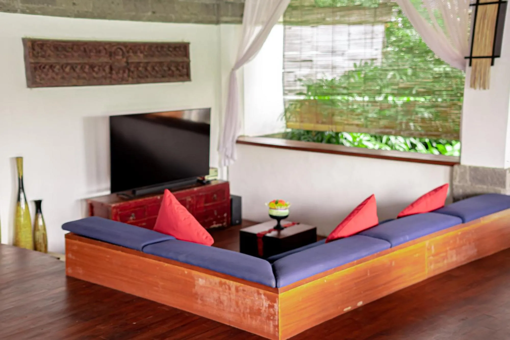 Communal lounge/ TV room in The Lotus Residence by Amerta Experience