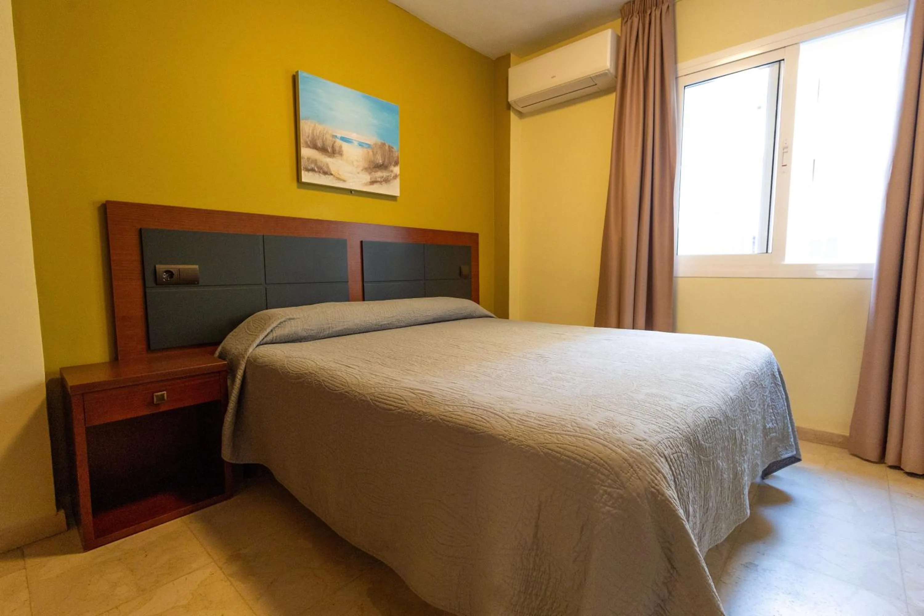 Bed in Apartamentos La Jabega