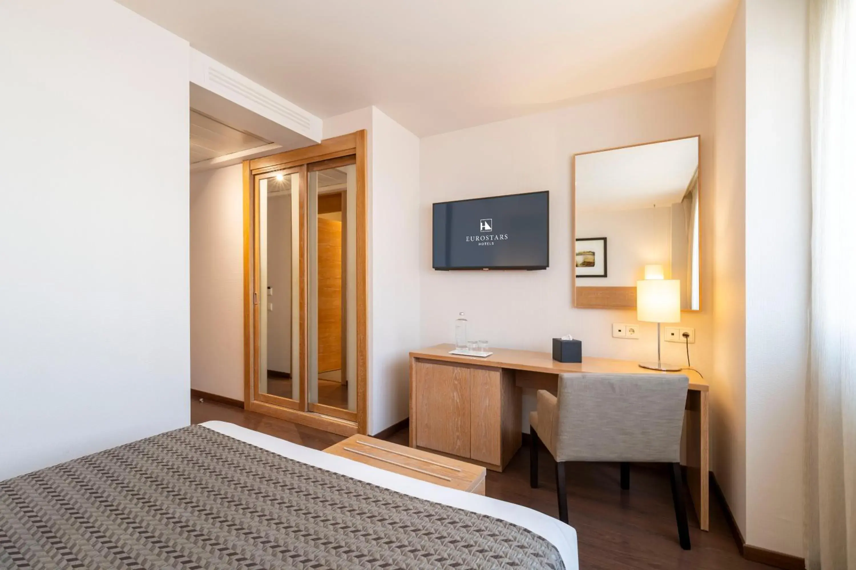 TV and multimedia, Bed in Eurostars Lucentum TV and multimedia, Bed in Eurostars Lucentum