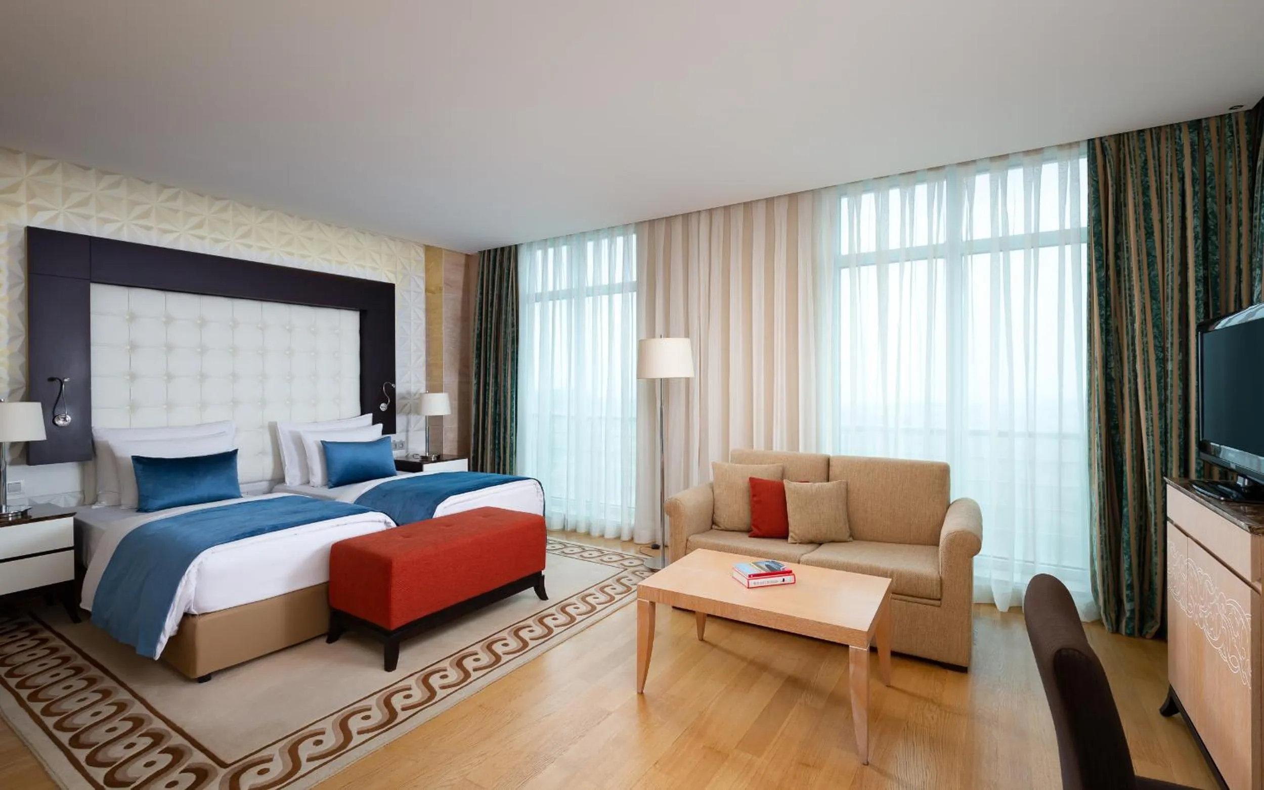 Seating area, Bed in Badamdar Hotel and Residences