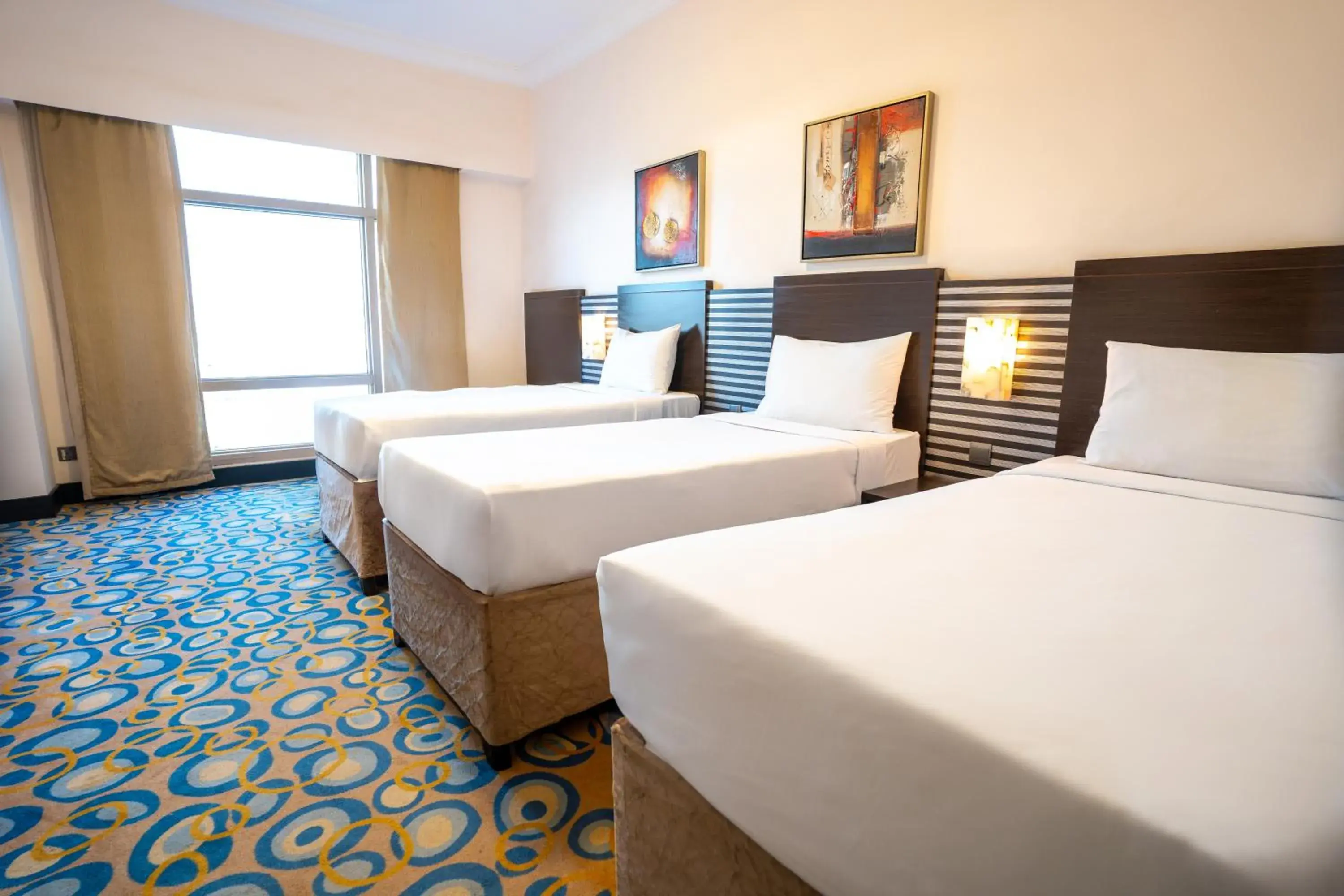 Standard Triple Room with Three Single Beds in Al Hidayah Towers Hotel Standard Triple Room with Three Single Beds in Al Hidayah Towers Hotel