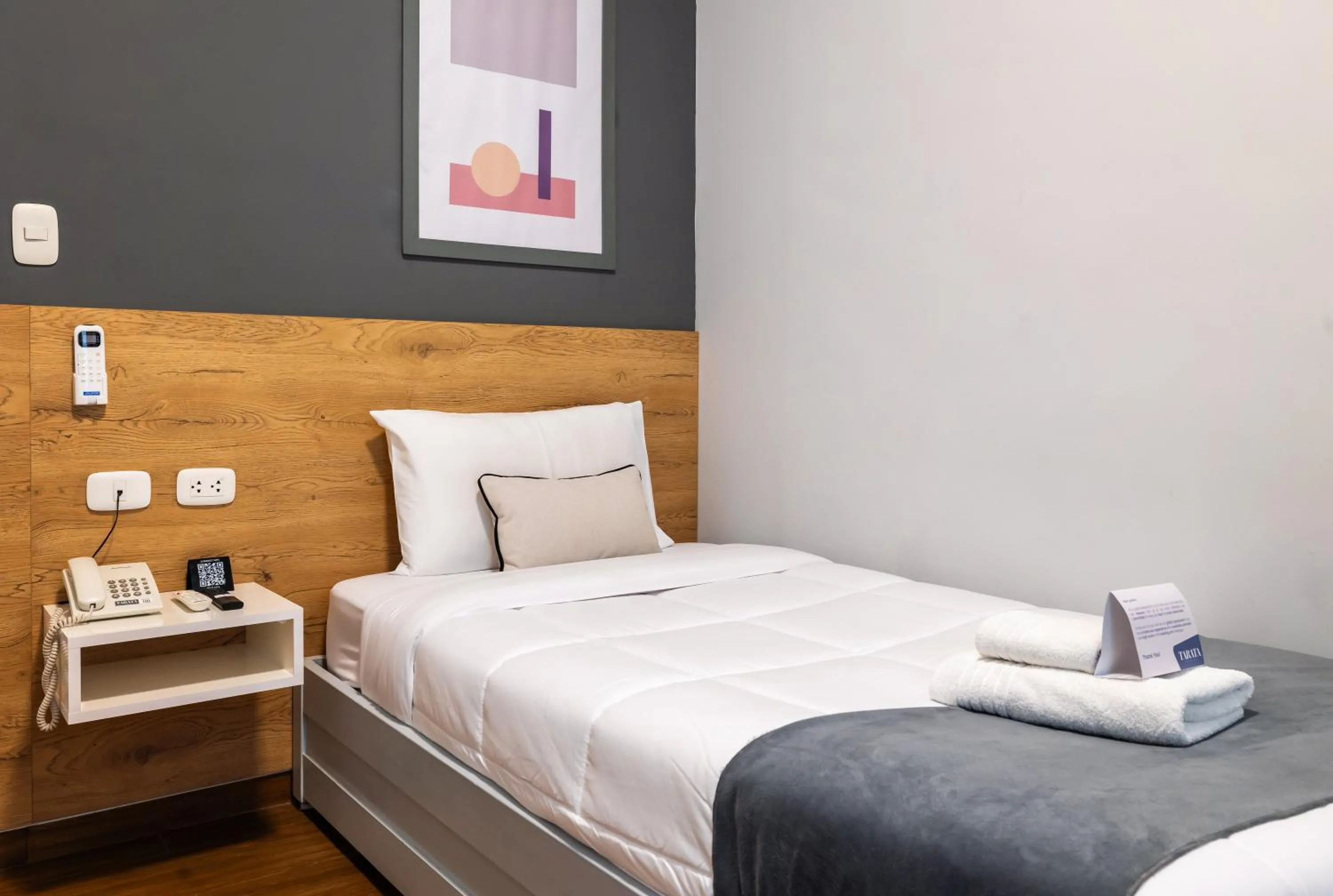 Bed in TARATA BOUTIQUE HOTEL