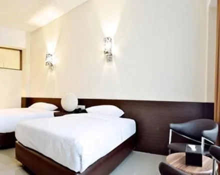 Bed in BAMBOO INN HOTEL & CAFE