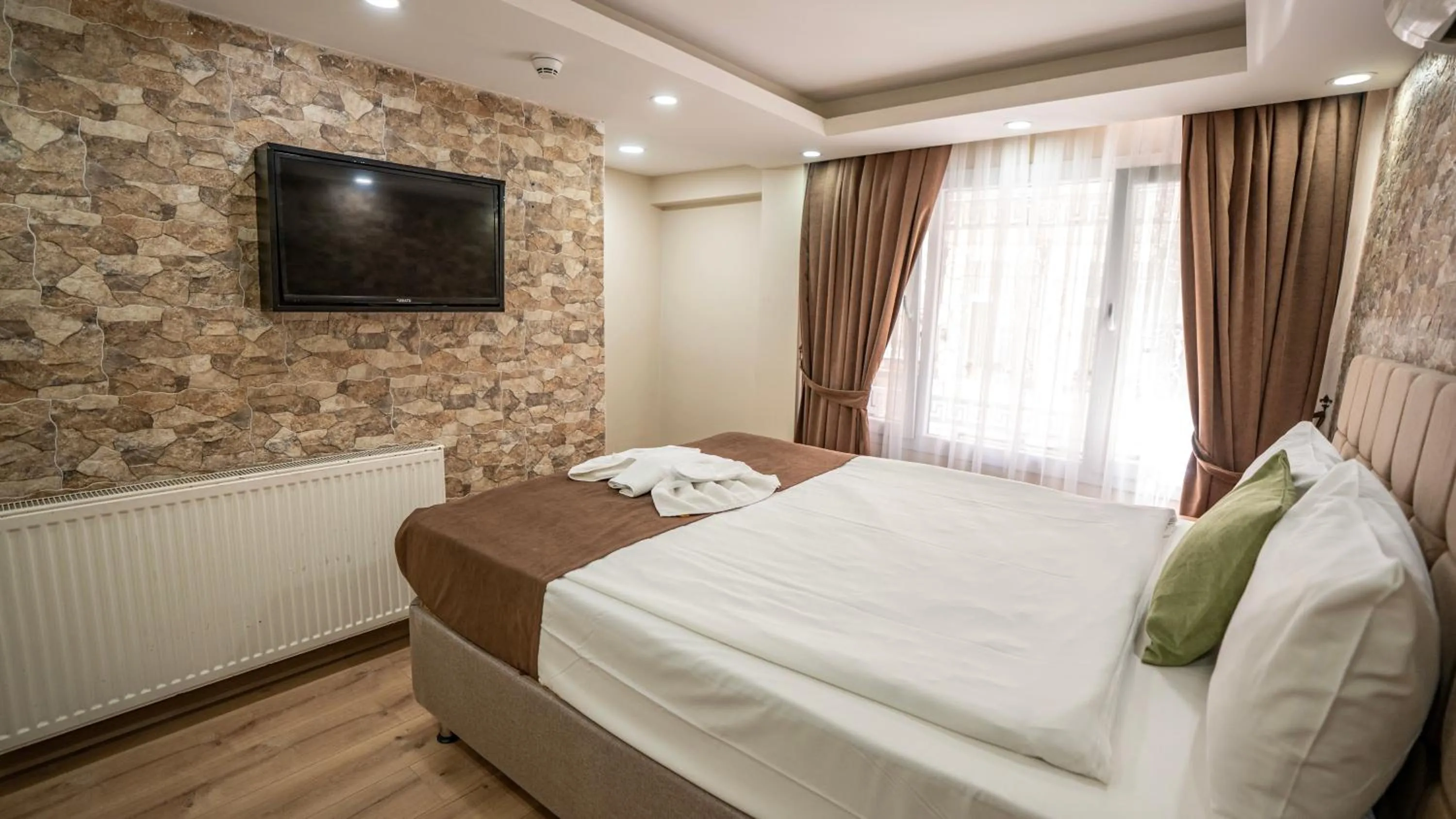 Bed in MİLA SUİTES TAKSİM