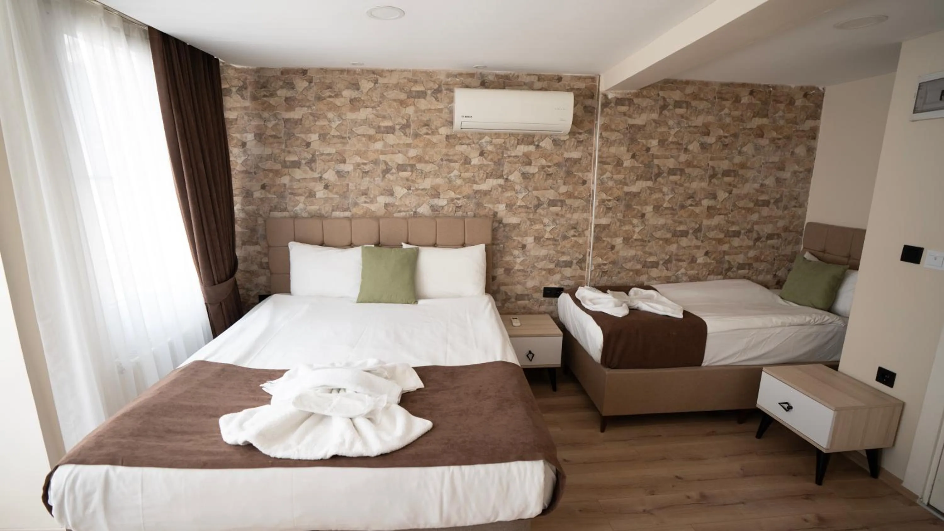 Bed in MİLA SUİTES TAKSİM