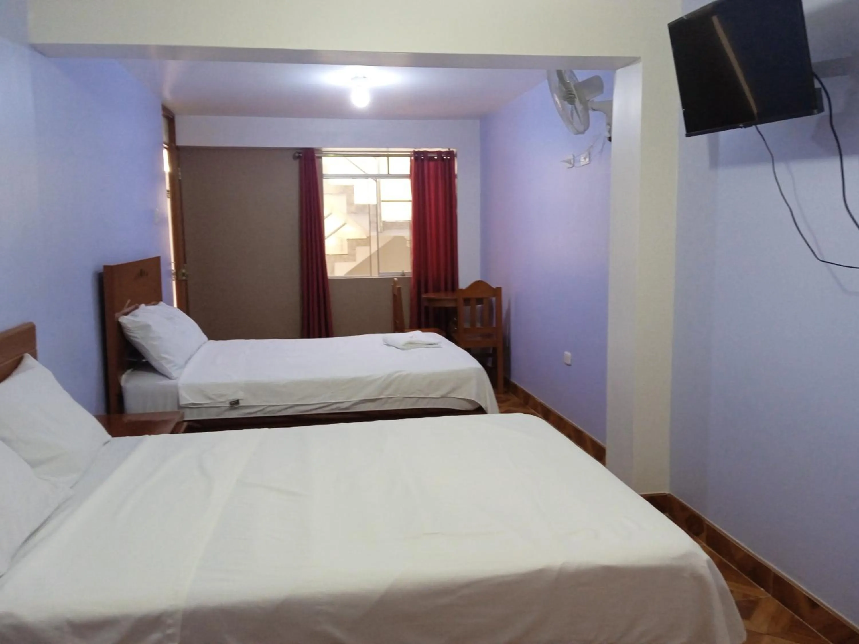 Bed in Hospedaje Feliz