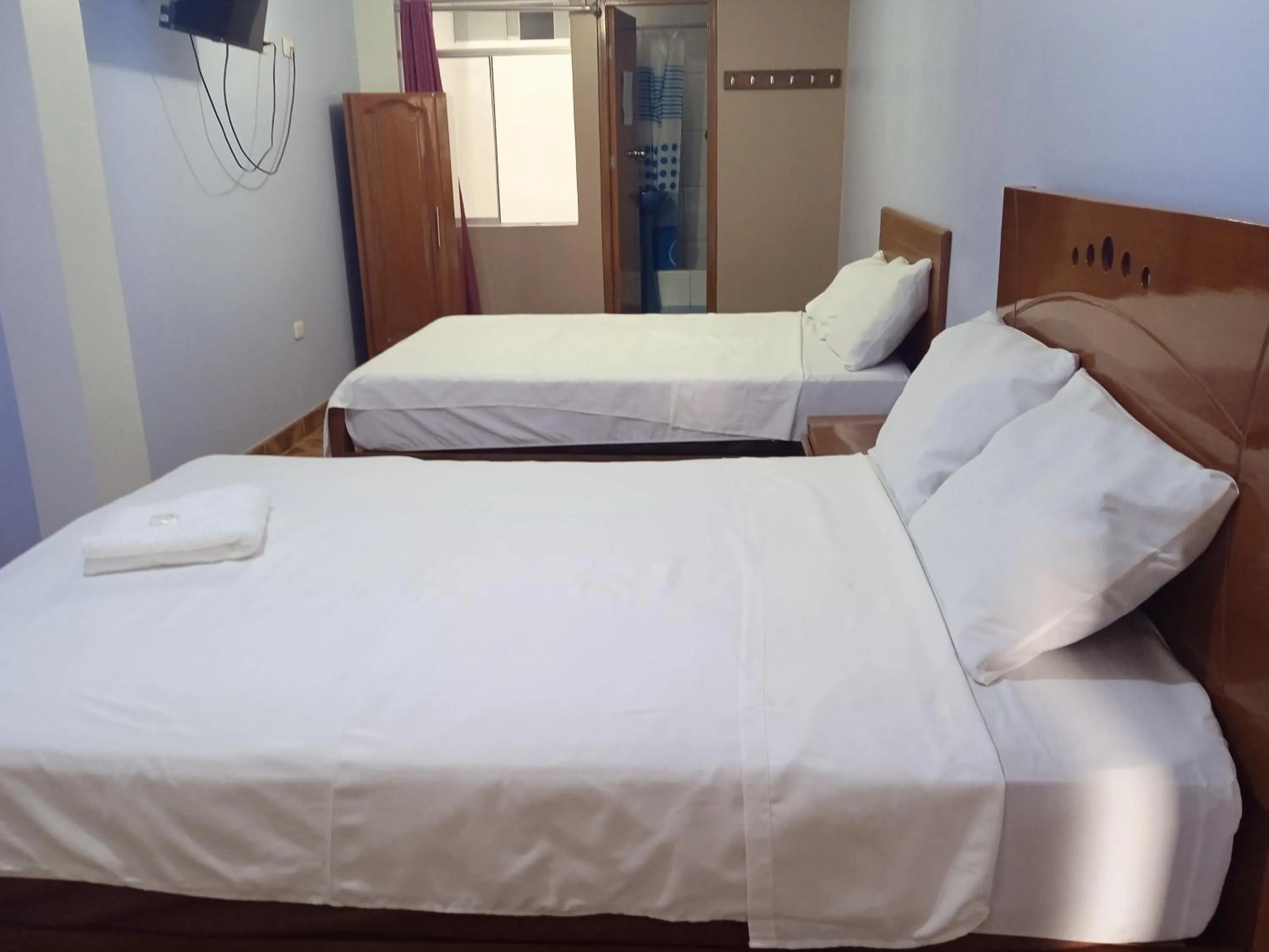 Bed in Hospedaje Feliz