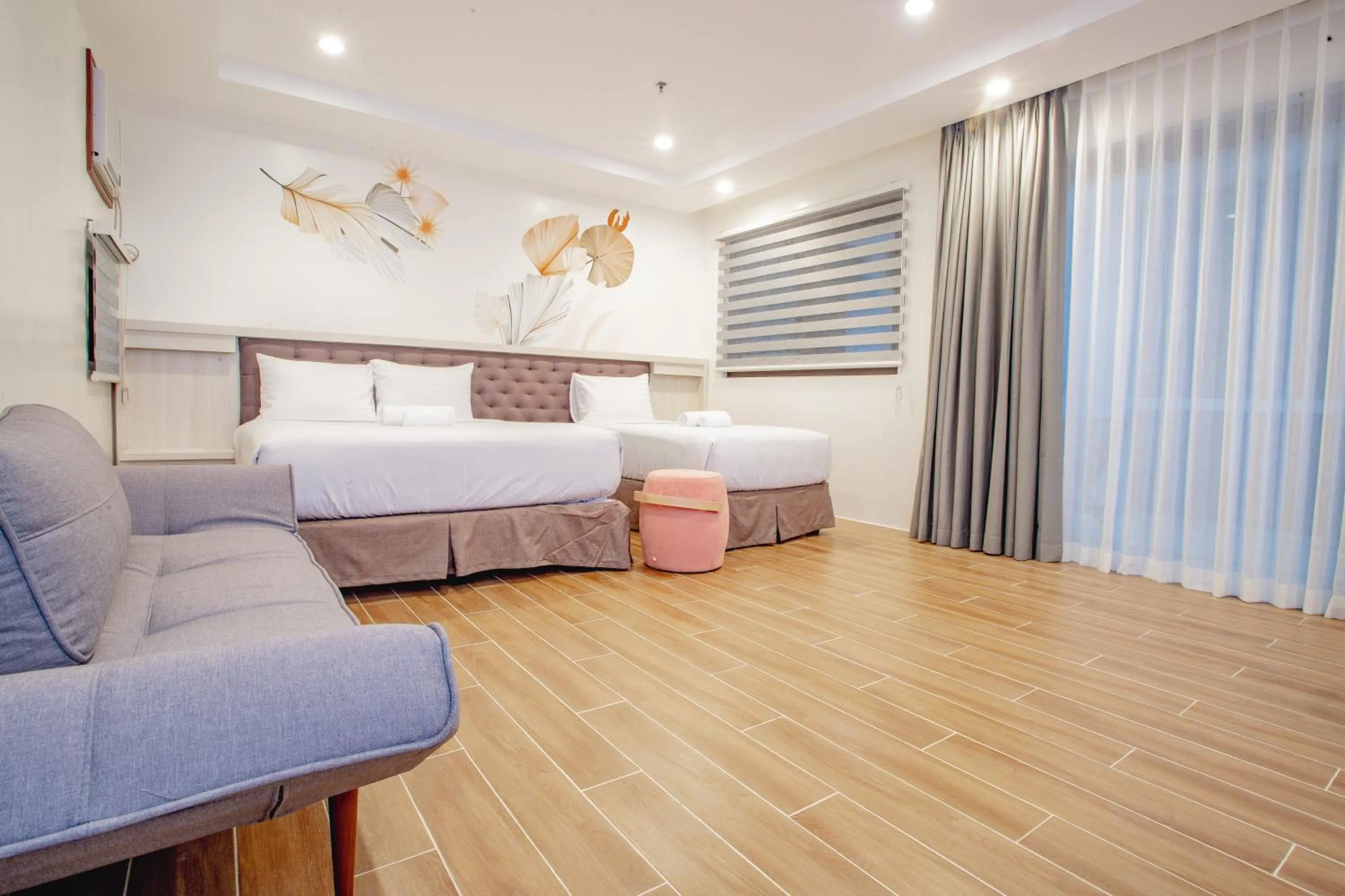 Seating area, Bed in Ora Beach Resort