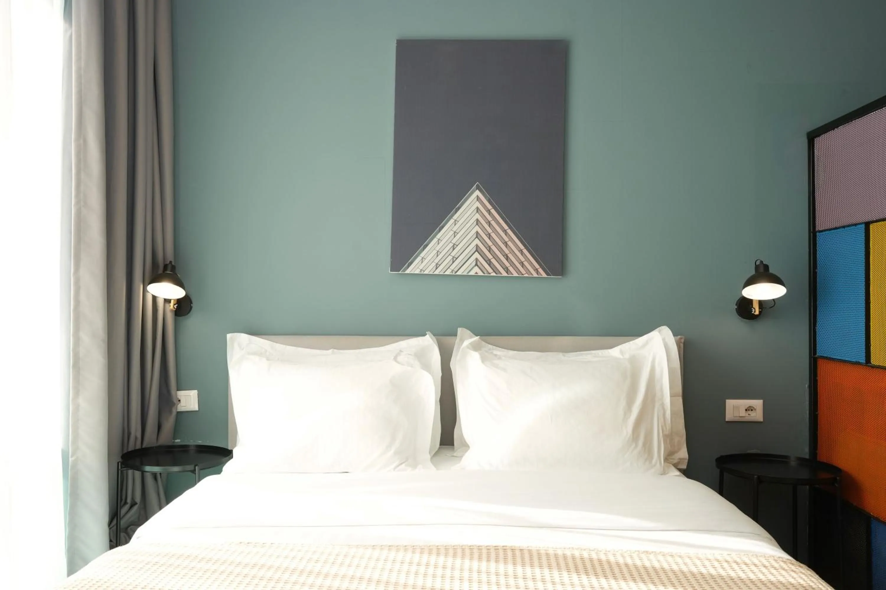 Bed in Ambassador Skyline Apartments