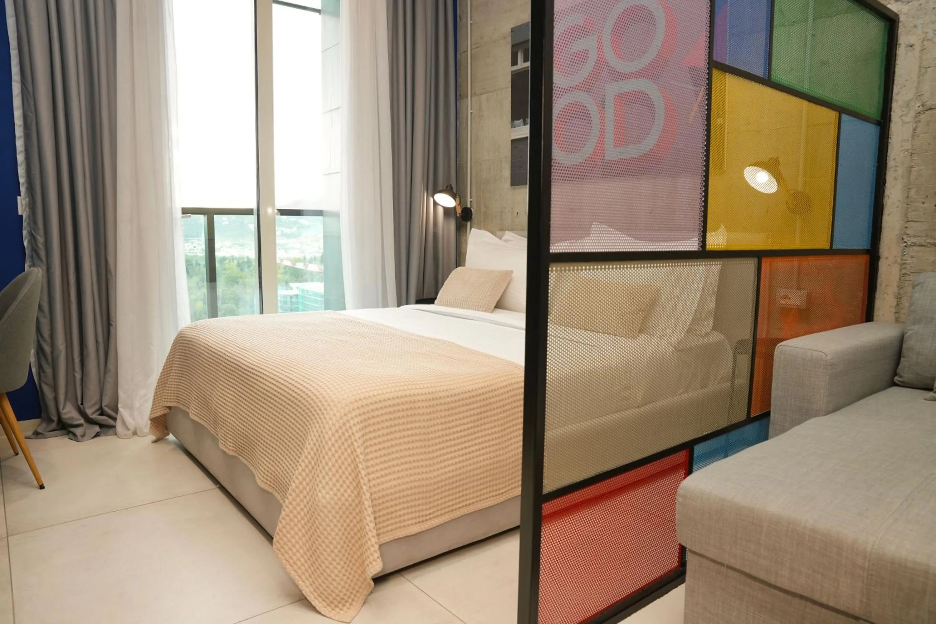 Bed in Ambassador Skyline Apartments