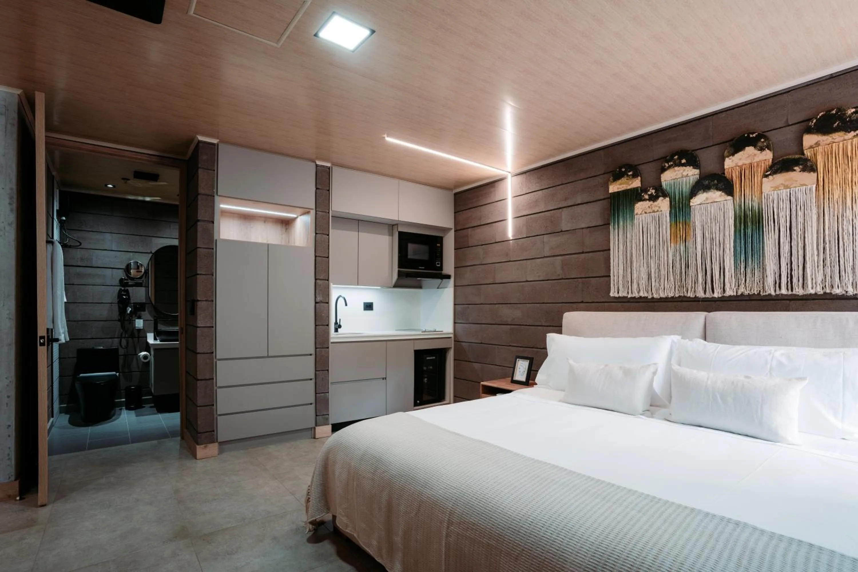 Bed in Hotel Living by Armoniko