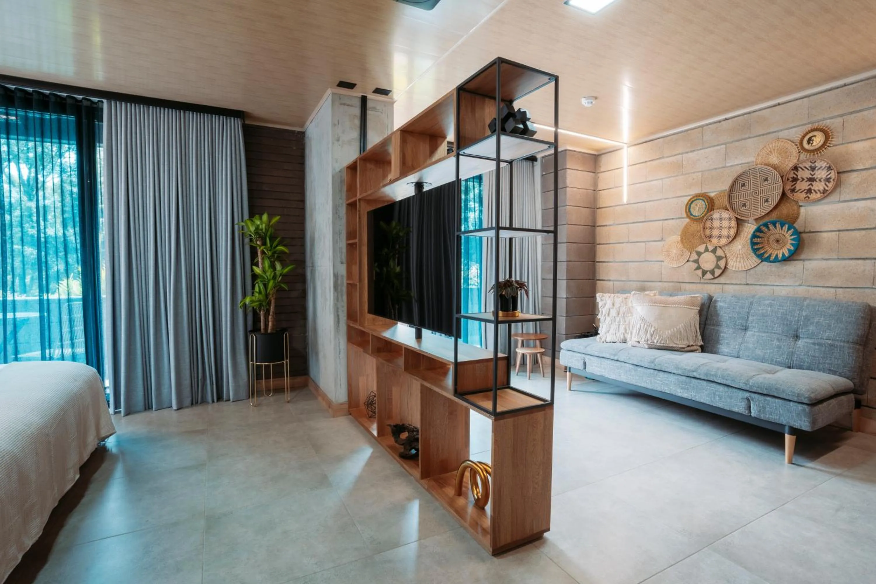 Communal lounge/ TV room, Bed in Hotel Living by Armoniko