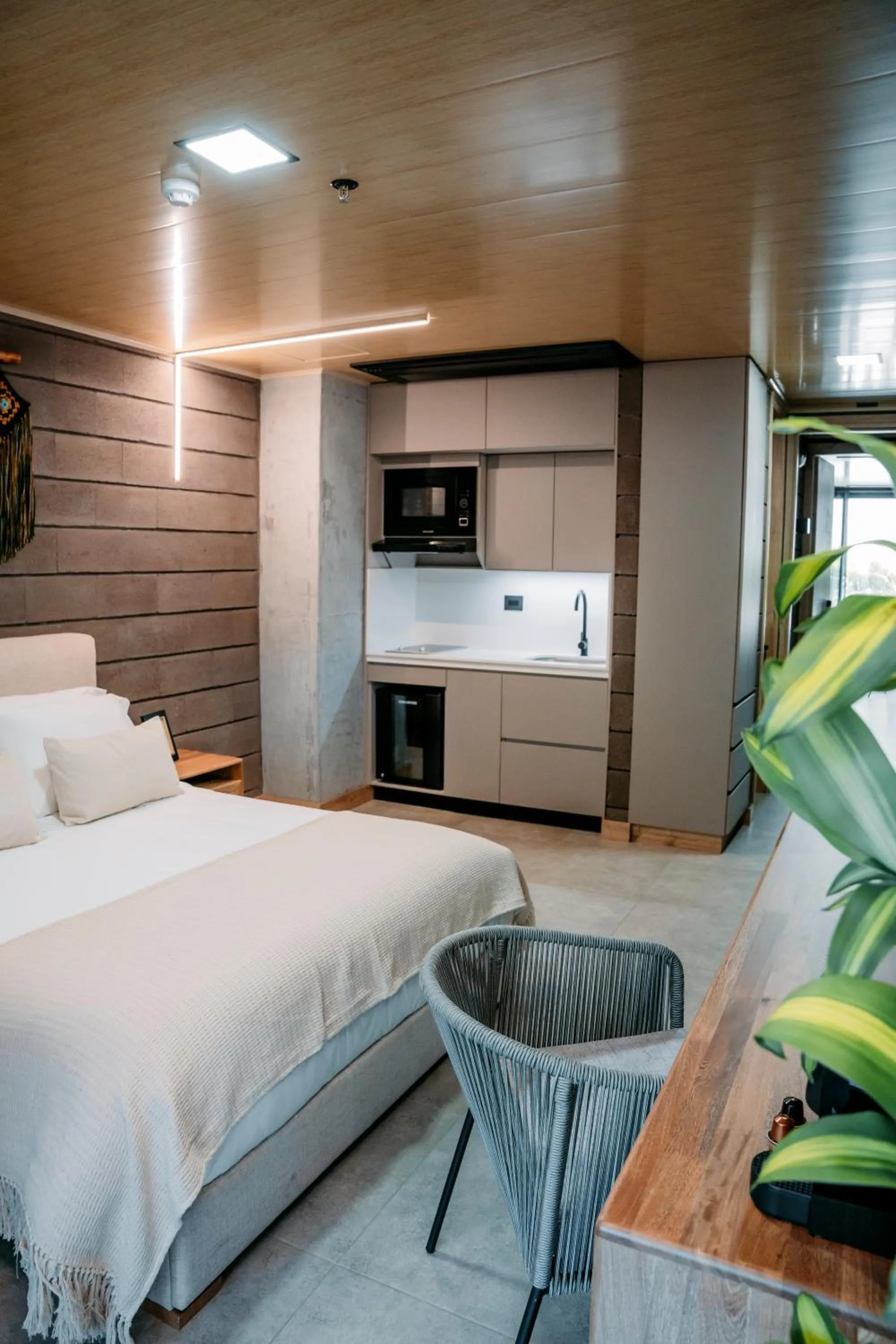 Bed in Hotel Living by Armoniko