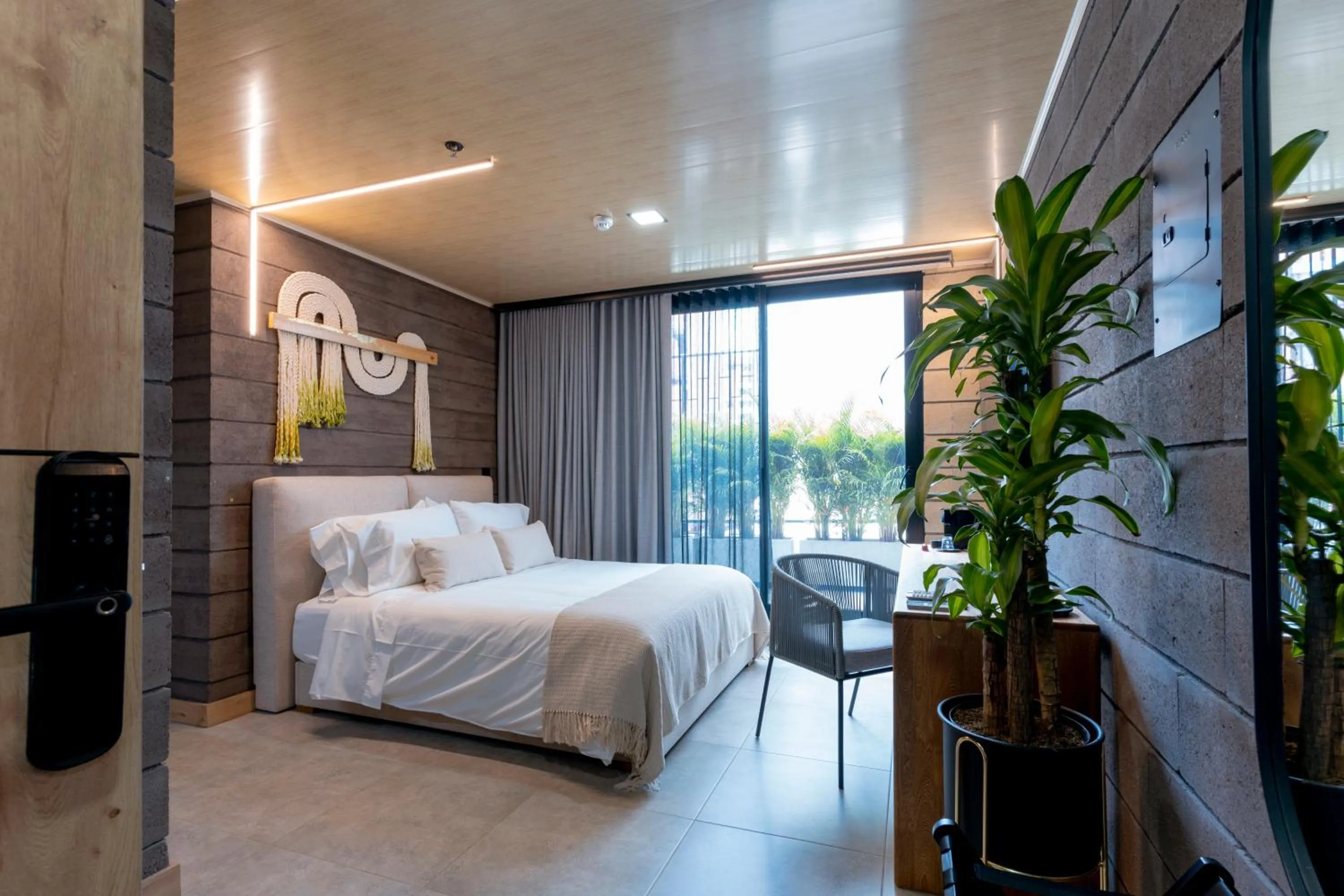 Bed in Hotel Living by Armoniko