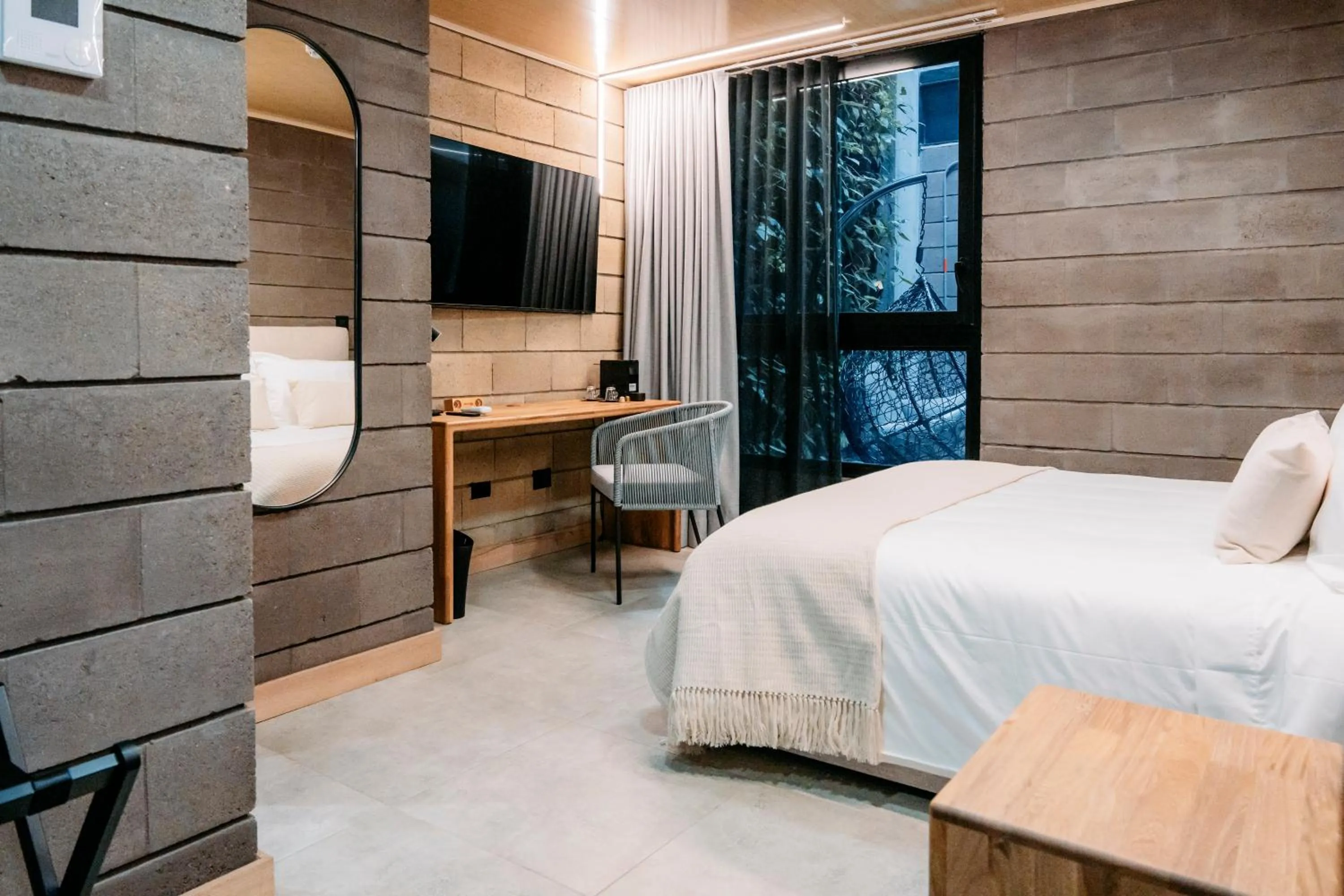 Bed in Hotel Living by Armoniko