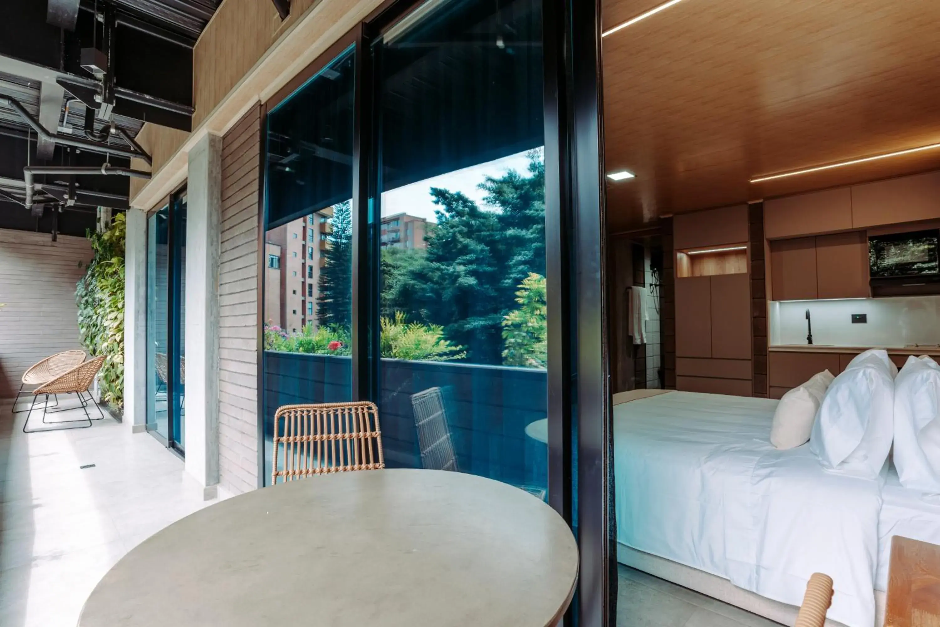 Balcony/Terrace, Bed in Hotel Living by Armoniko Balcony/Terrace, Bed in Hotel Living by Armoniko