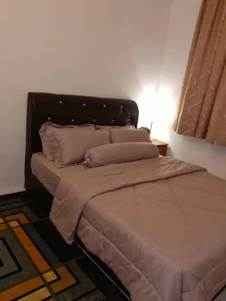 Bed in AWANA HOMESTAY