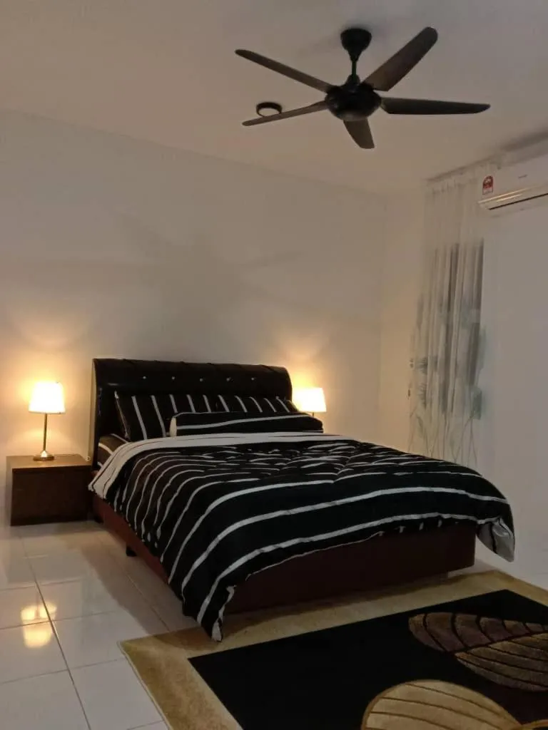 Bed in AWANA HOMESTAY