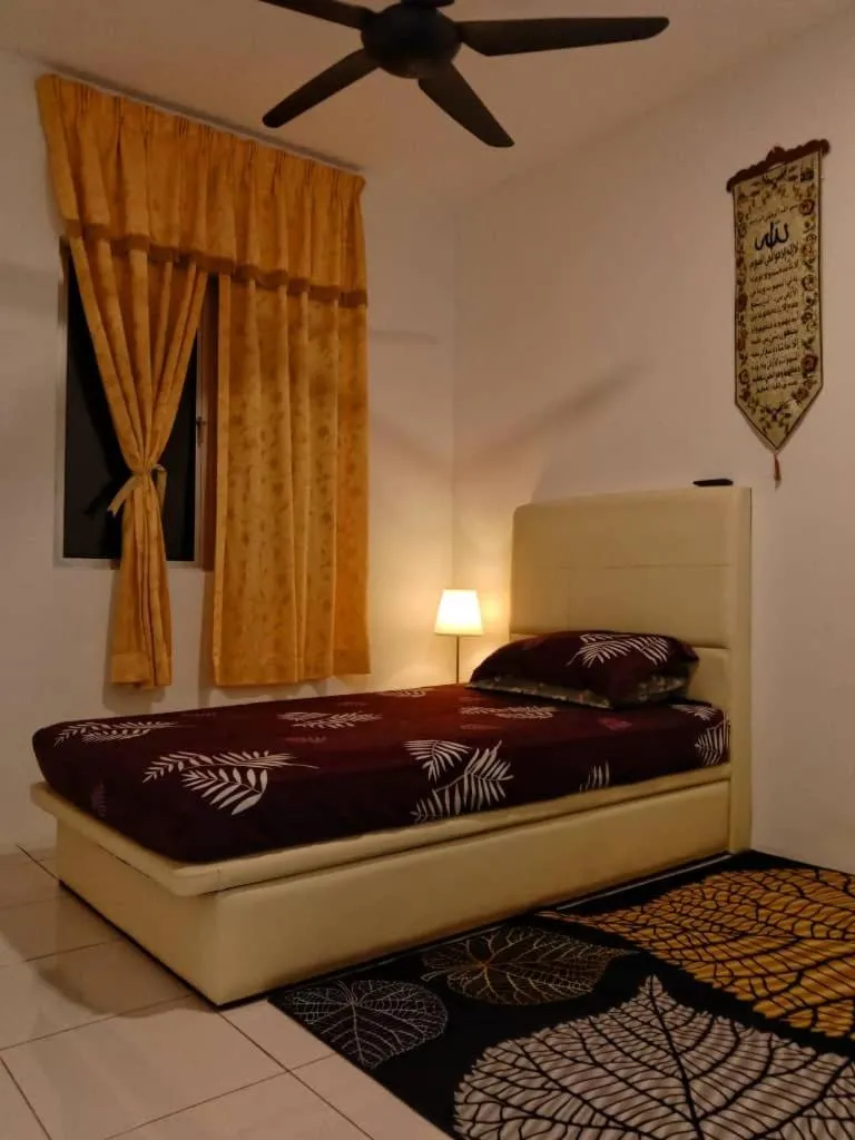 Bed in AWANA HOMESTAY