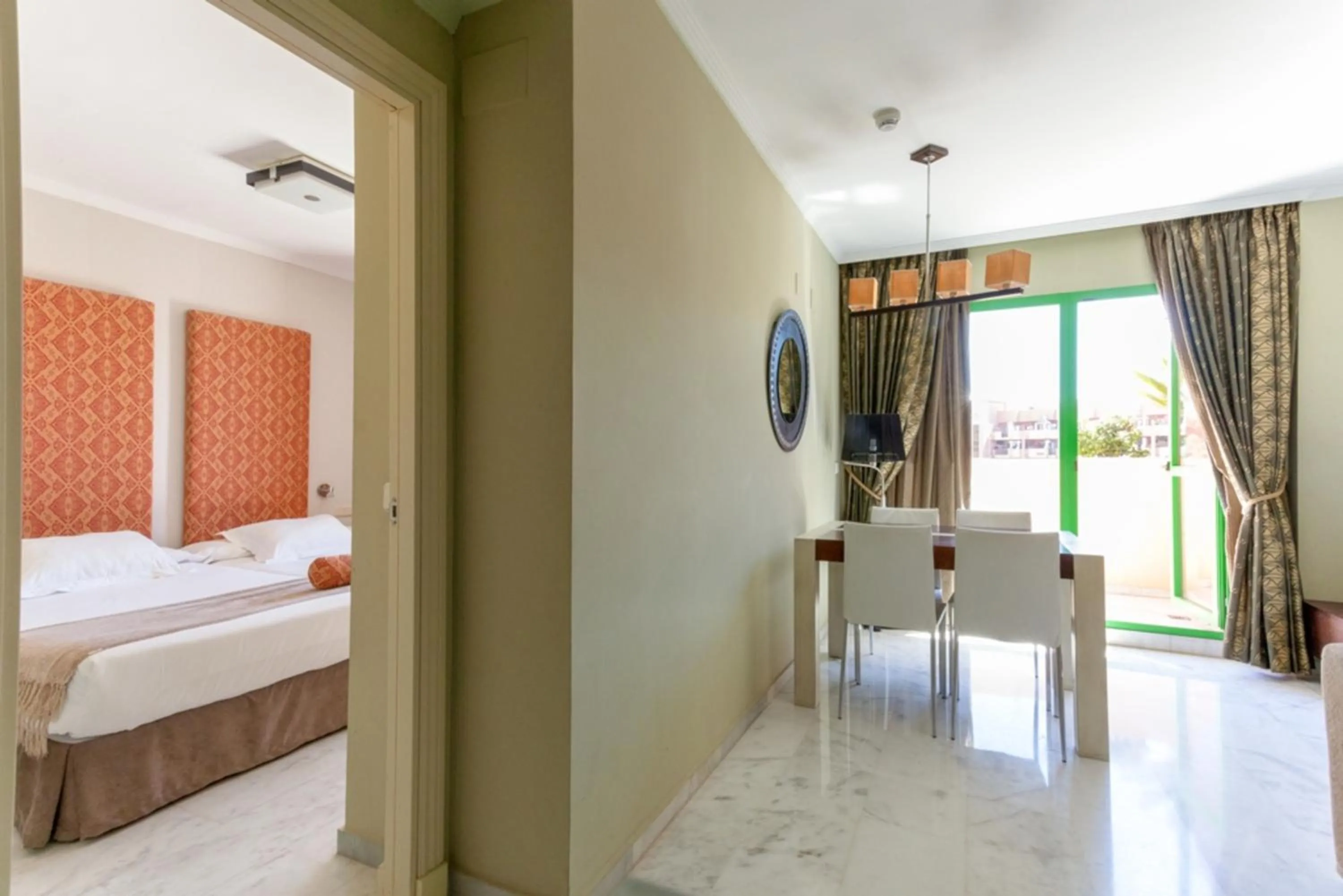 Dining area, Bed in Holiday World RIWO Hotel.