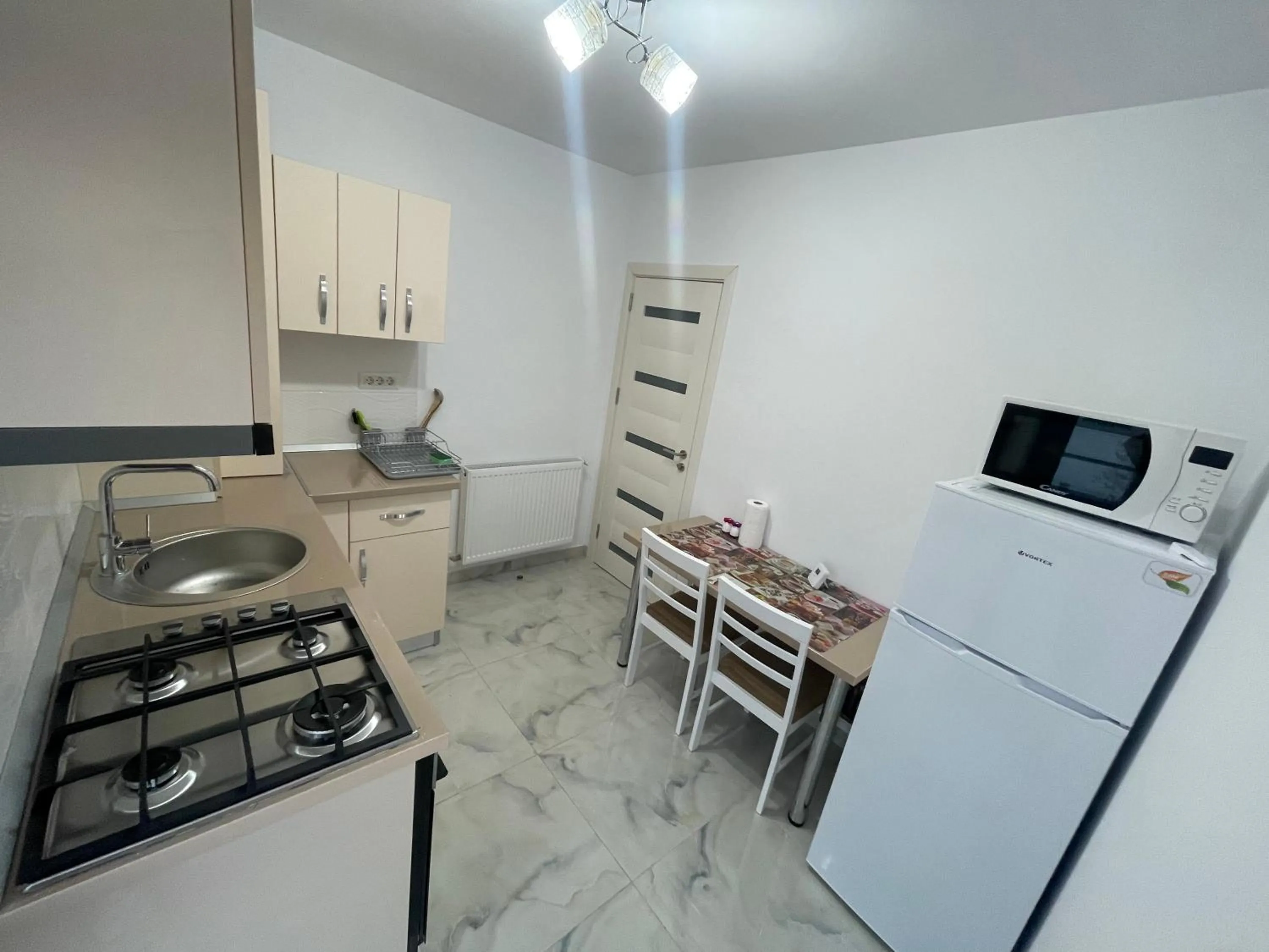 Kitchen or kitchenette in Pensiunea Giulia