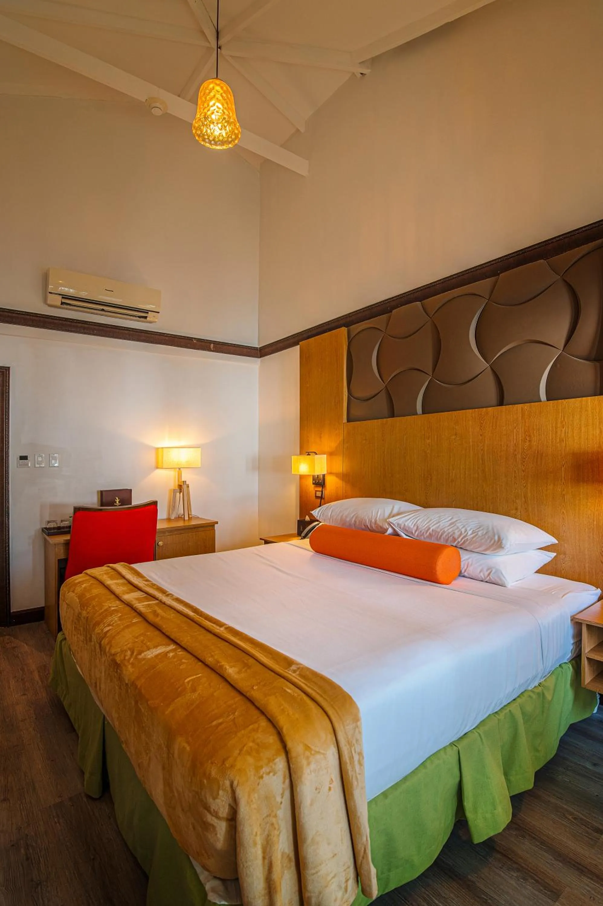 Bed in Sago Palm Hotel