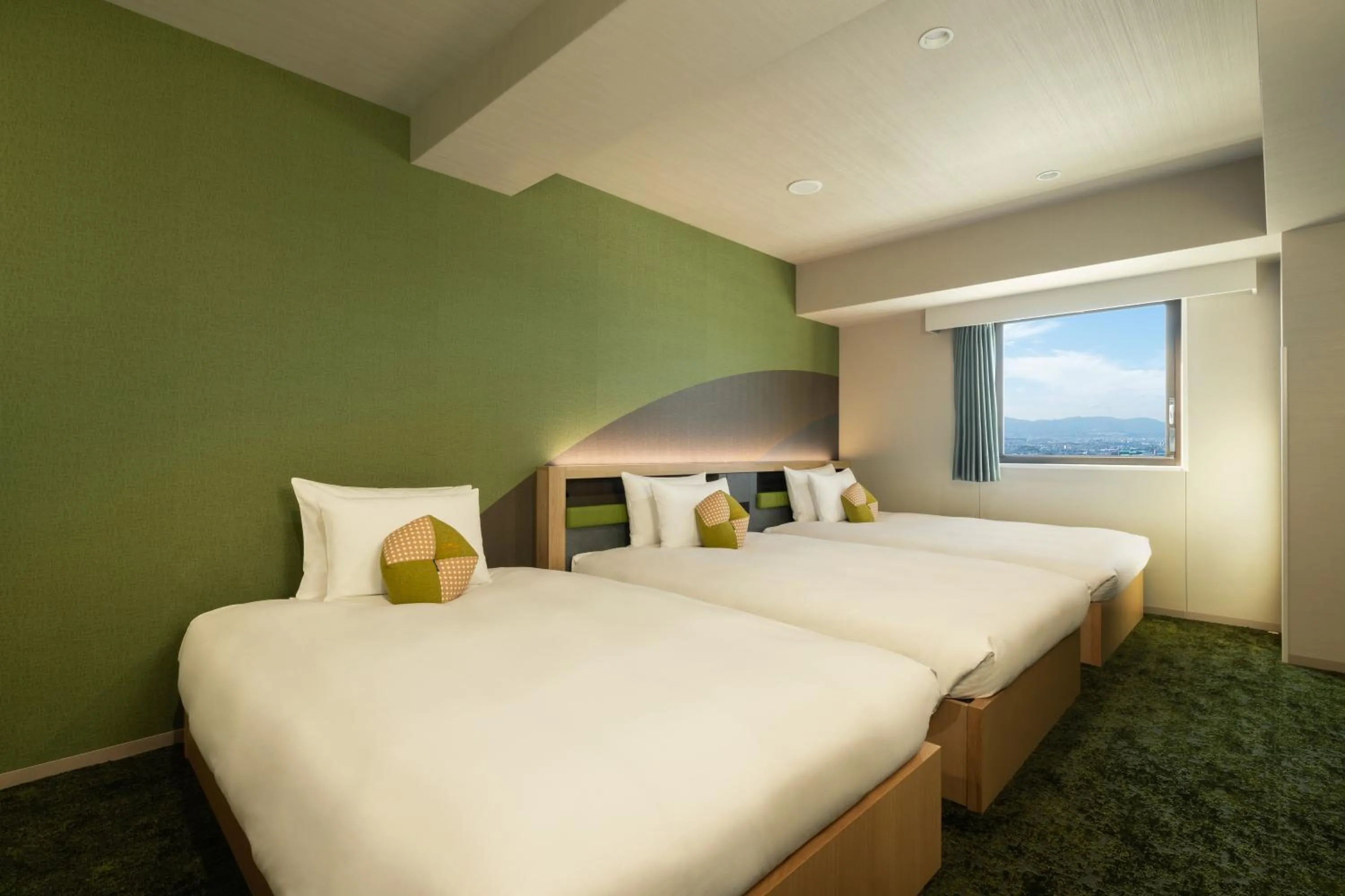 Bed in OMO Kansai Airport by Hoshino Resorts