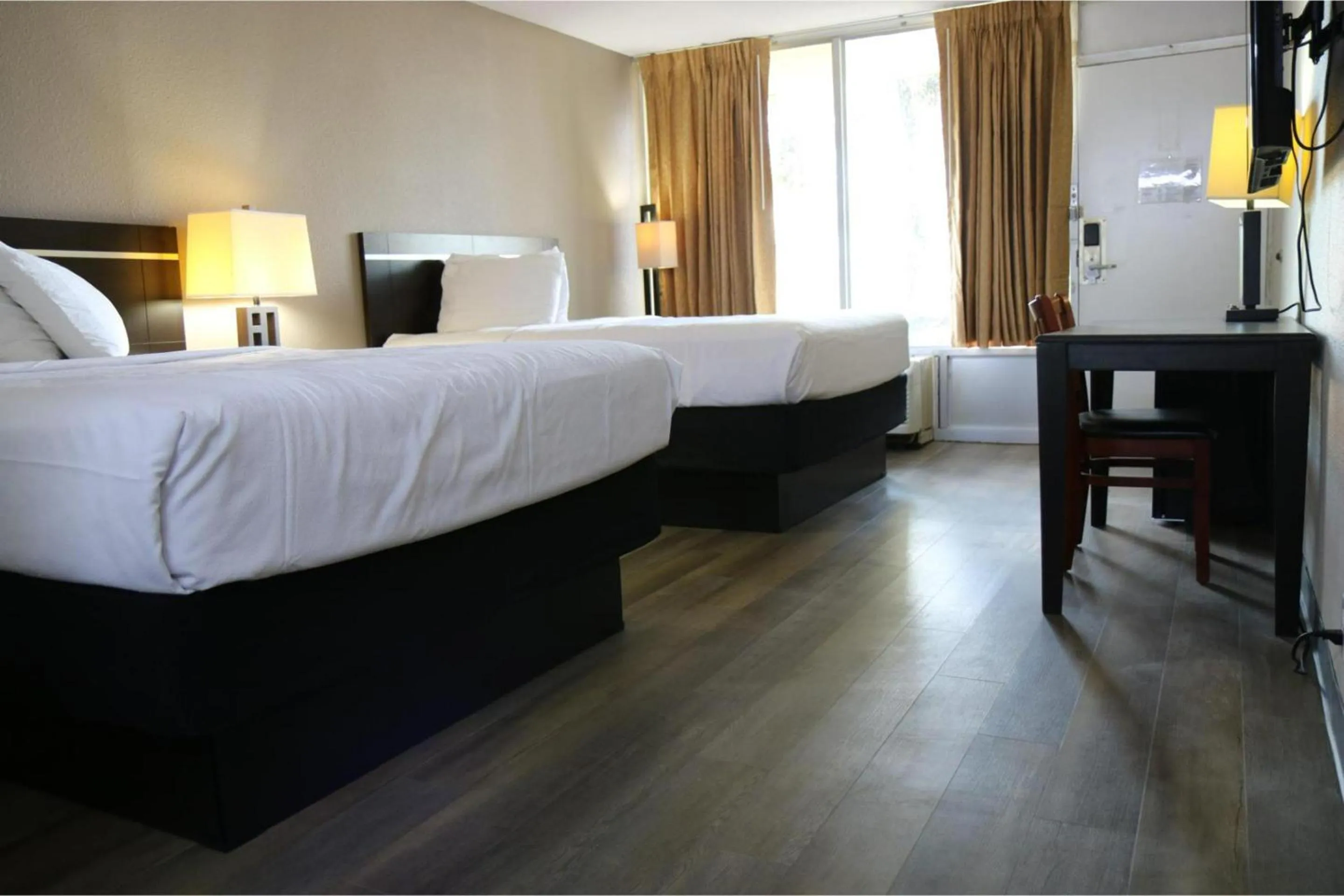 Bedroom, Bed in Heritage Inn & Suites by Capital O Baton Rouge I 10