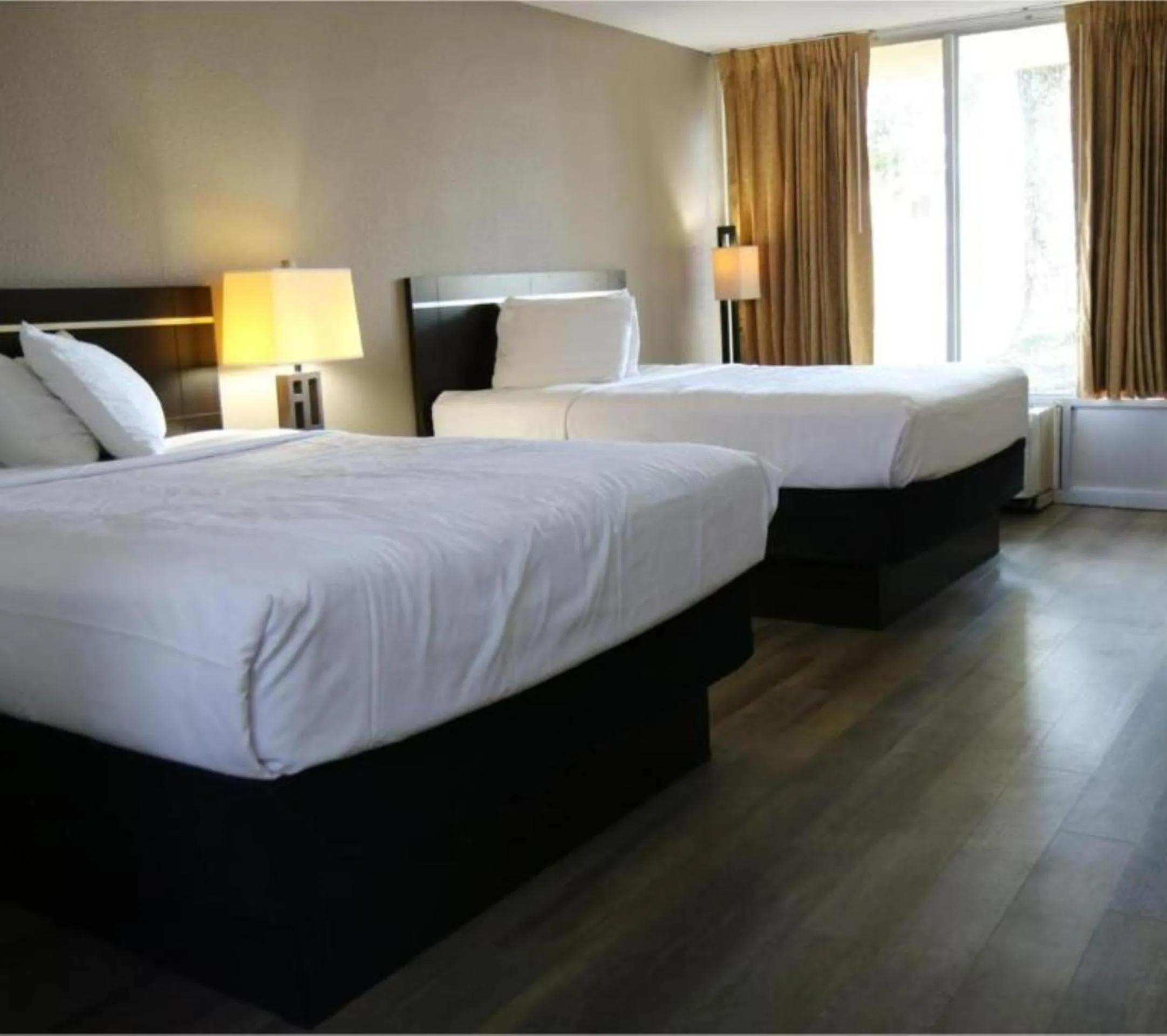 Bedroom, Bed in Heritage Inn & Suites by Capital O Baton Rouge I 10