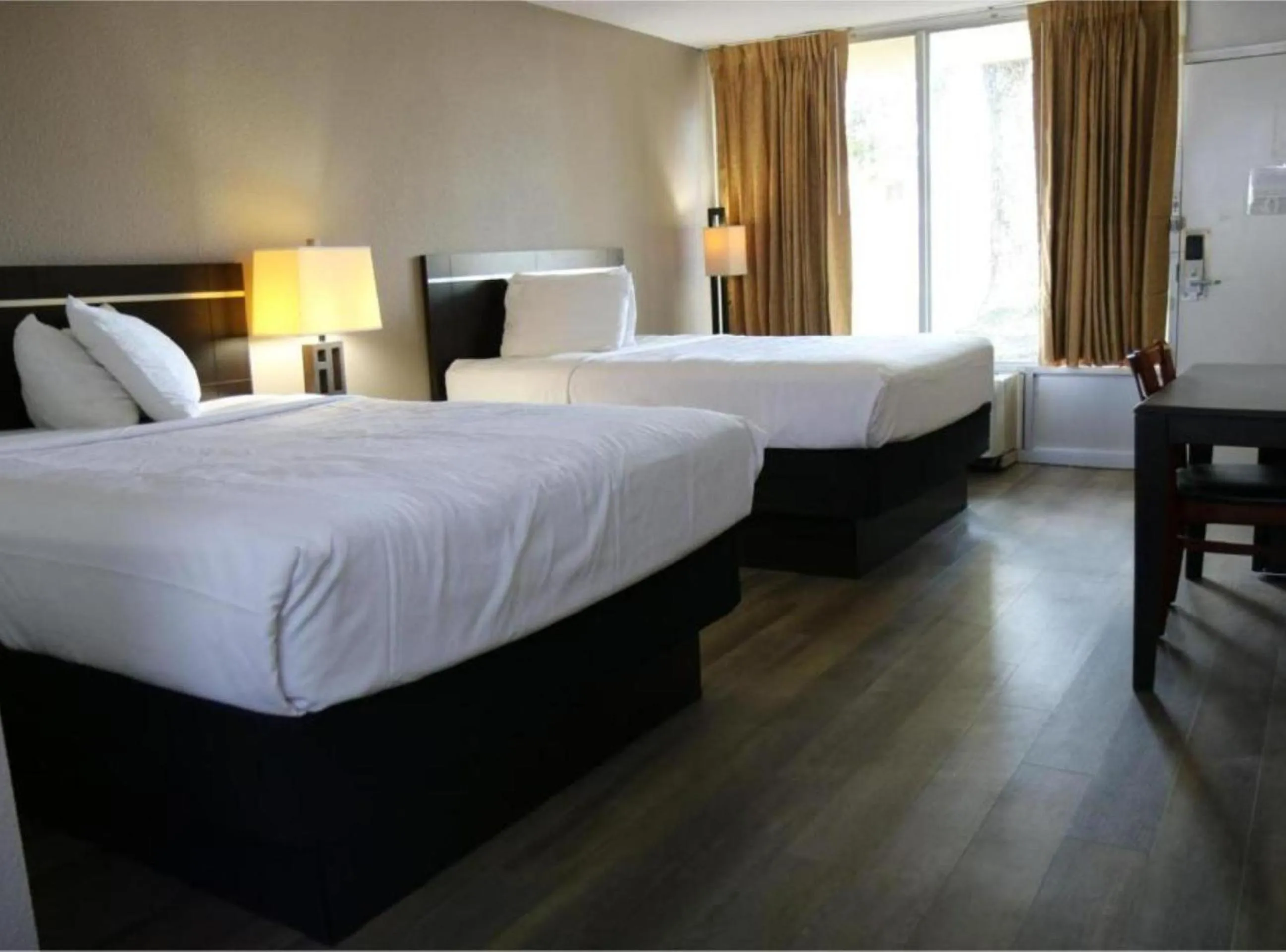 Bedroom, Bed in Heritage Inn & Suites by Capital O Baton Rouge I 10