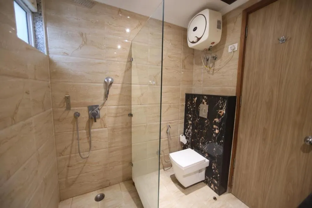 Shower in The Elevate Hotel Near Delhi Airport With- Free Airport PICKUP