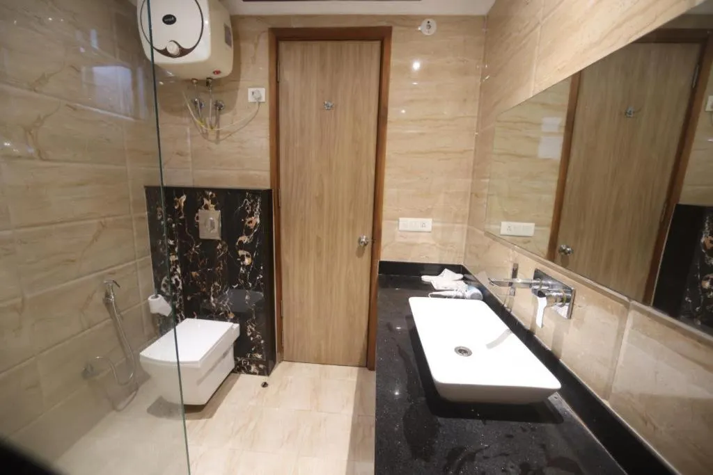 Shower in The Elevate Hotel Near Delhi Airport With- Free Airport PICKUP