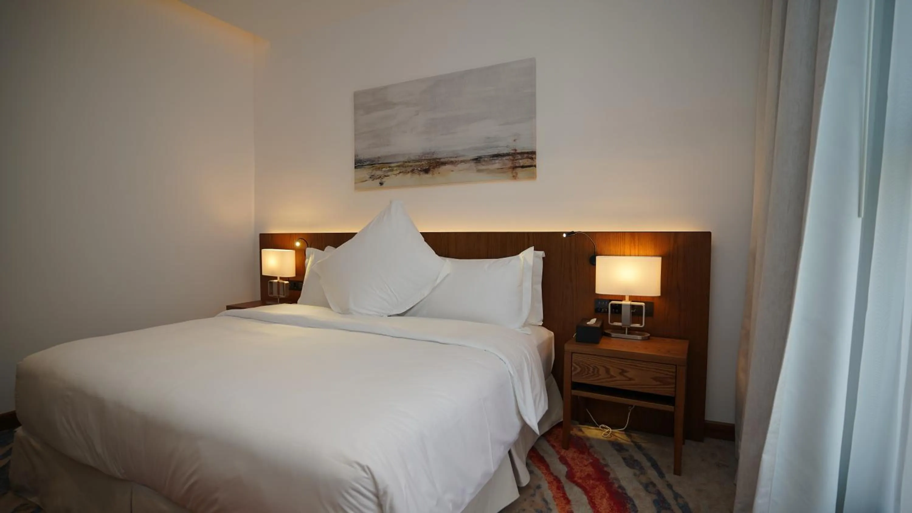 Bed in Jasmine Garden Hotel