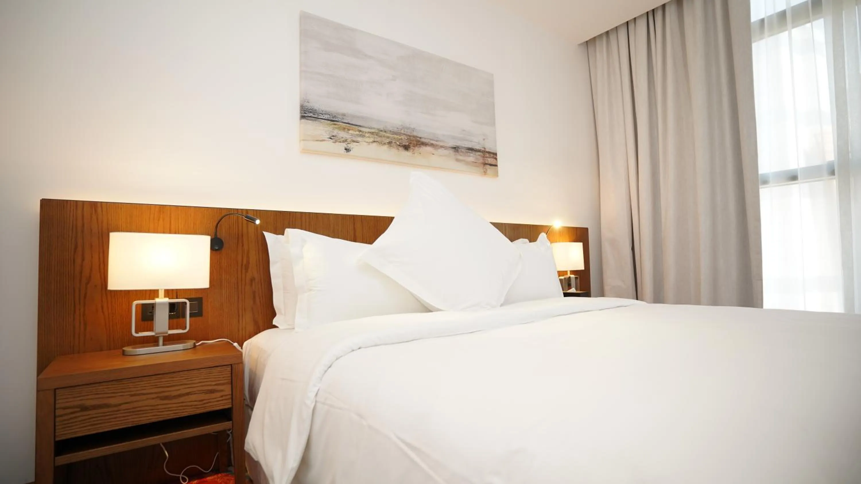 Bed in Jasmine Garden Hotel