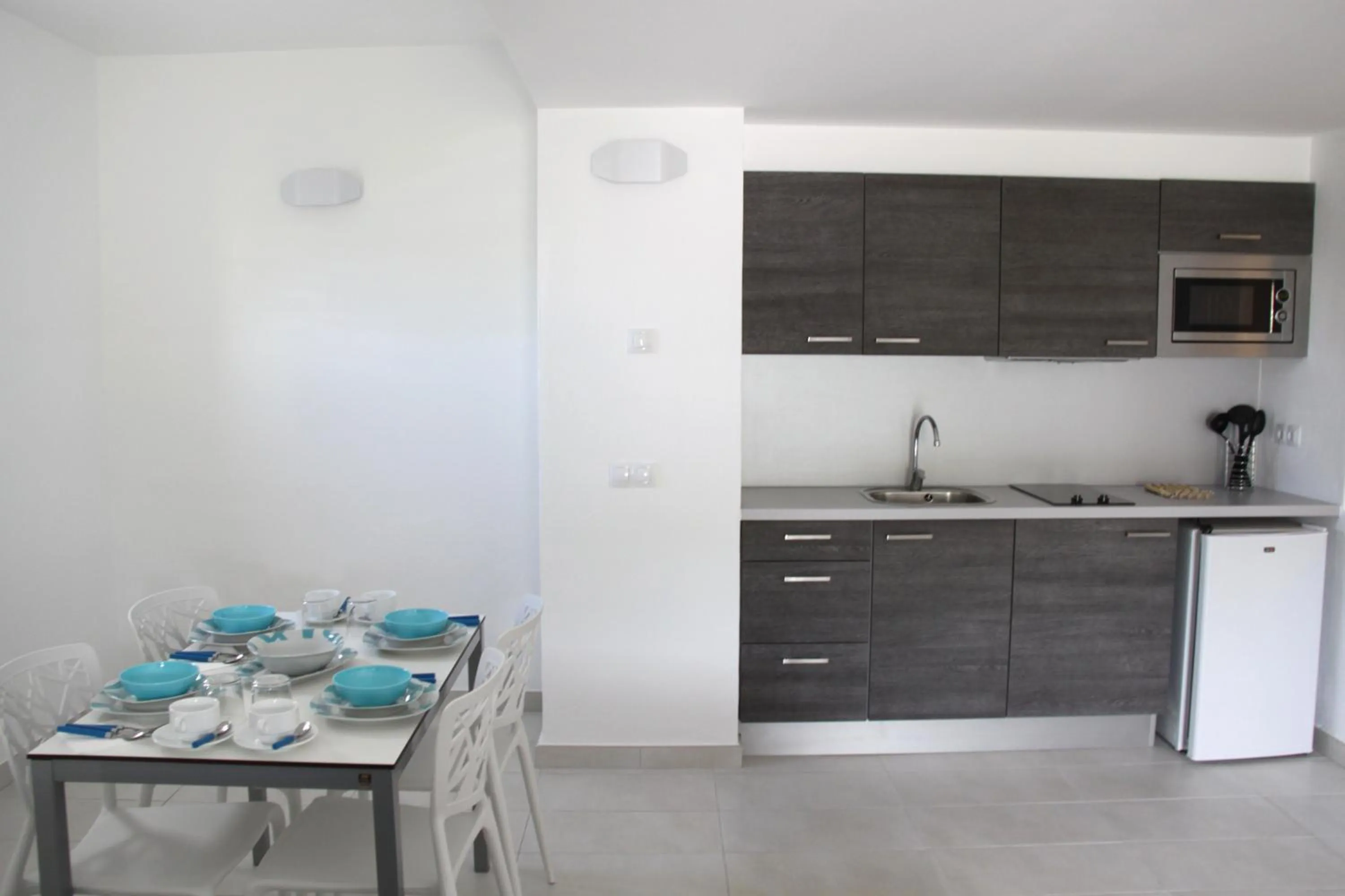Kitchen or kitchenette in Aparthotel Puerto Cala Vadella