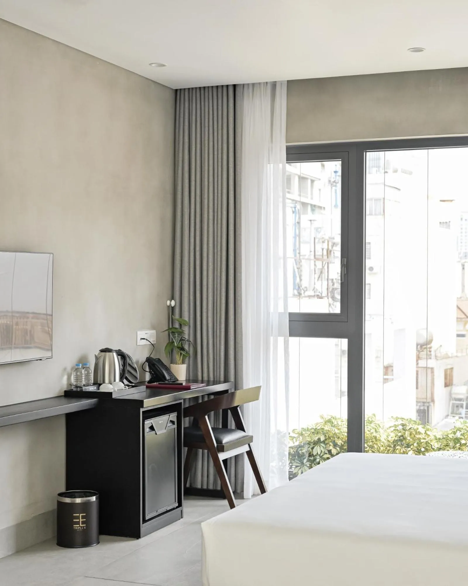 Decorative detail, Bed in Triple E Hotel Metro Ben Thanh