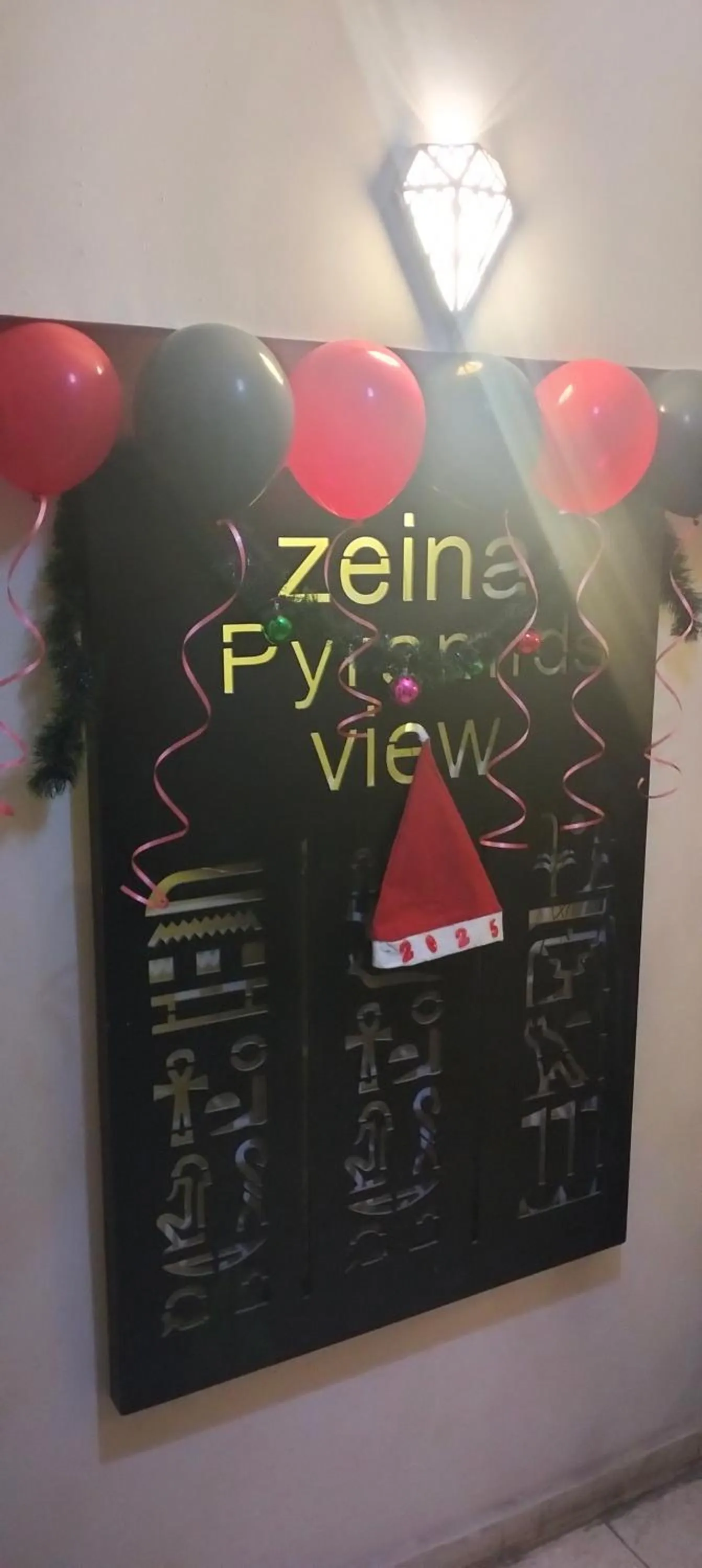 Property logo or sign in Zeina pyramids view