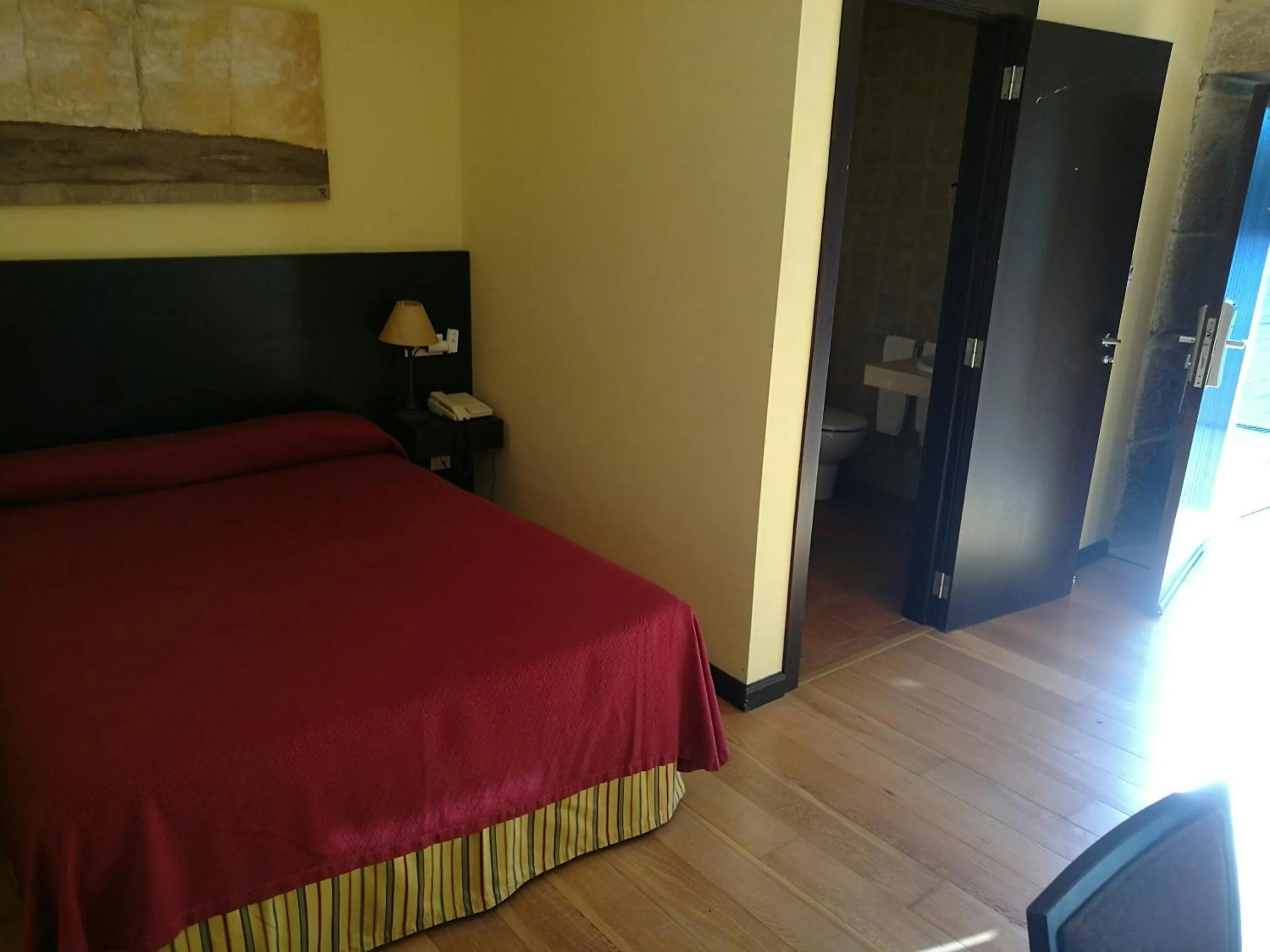 Bed in Hotel Pazo de Lestrove by Pousadas de Compostela