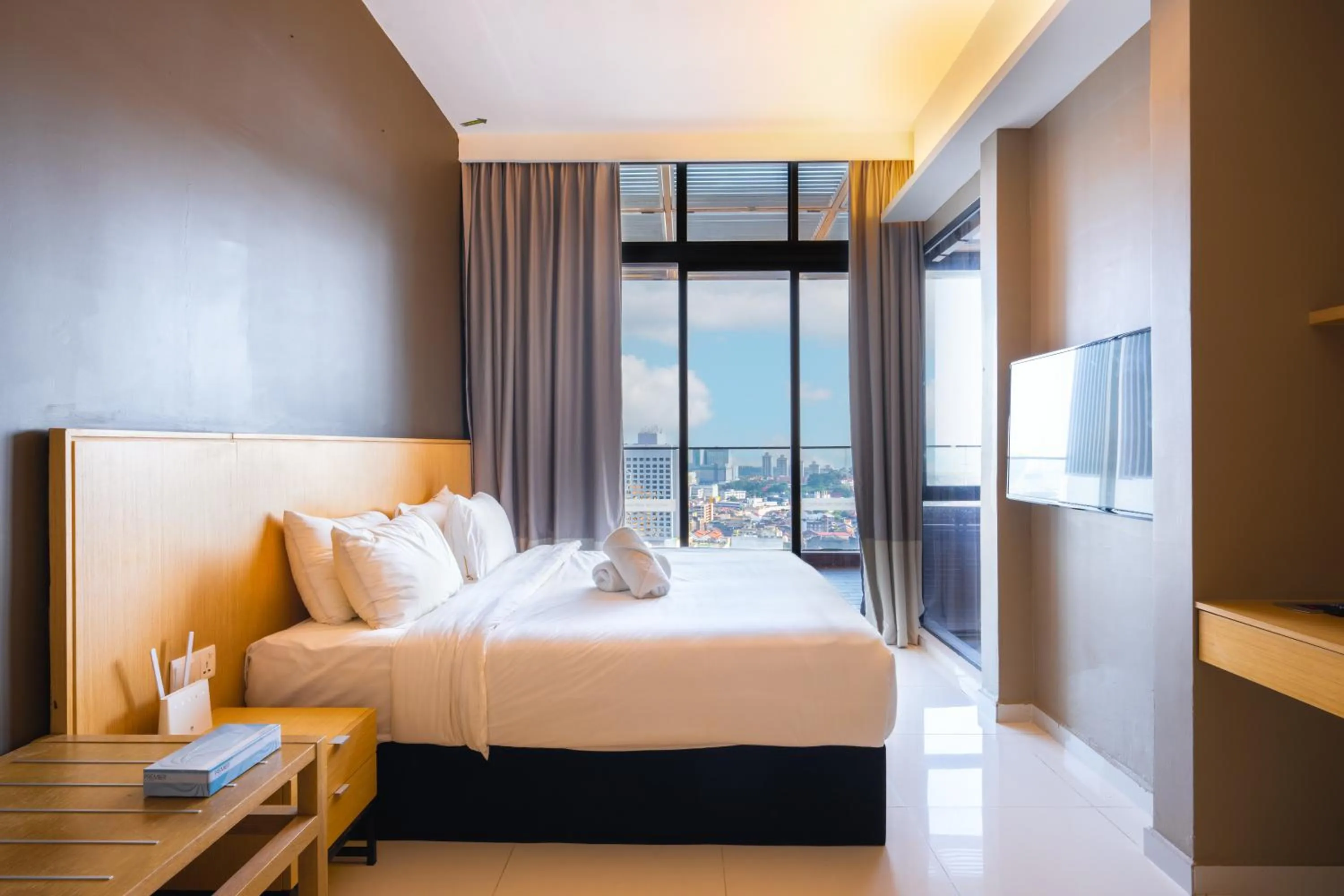 Bed in Greystone 99 Suites