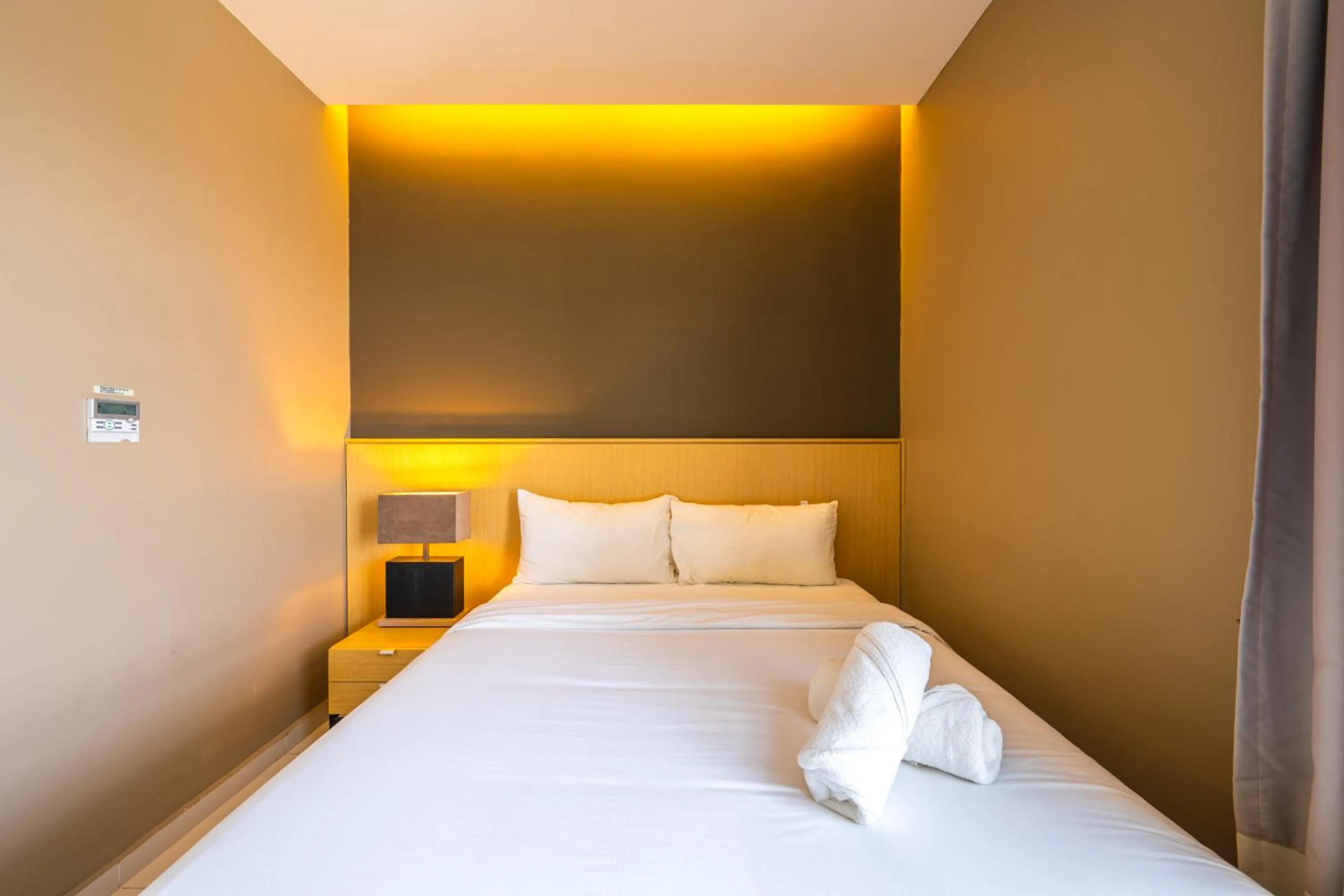 Bed in Greystone 99 Suites