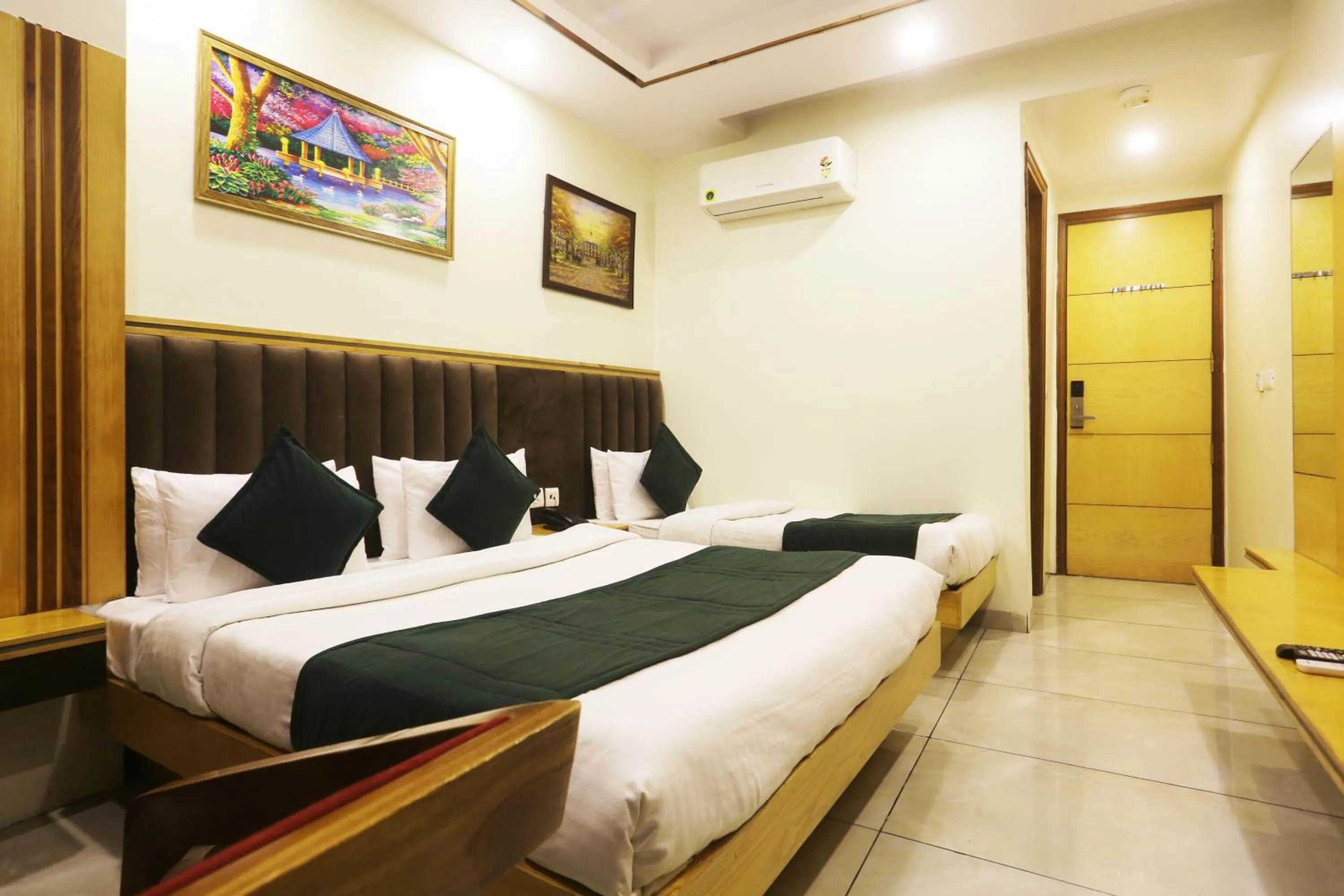 Photo of the whole room, Bed in Hotel Aman Imperial Just a Minute Away From New Delhi Railway Station and Connaught place
