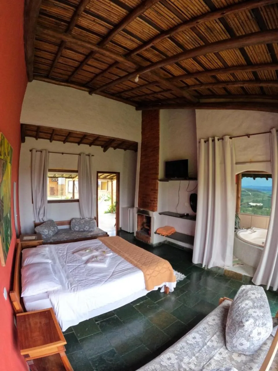 Communal lounge/ TV room, Bed in Pousada Mirante Serra Verde
