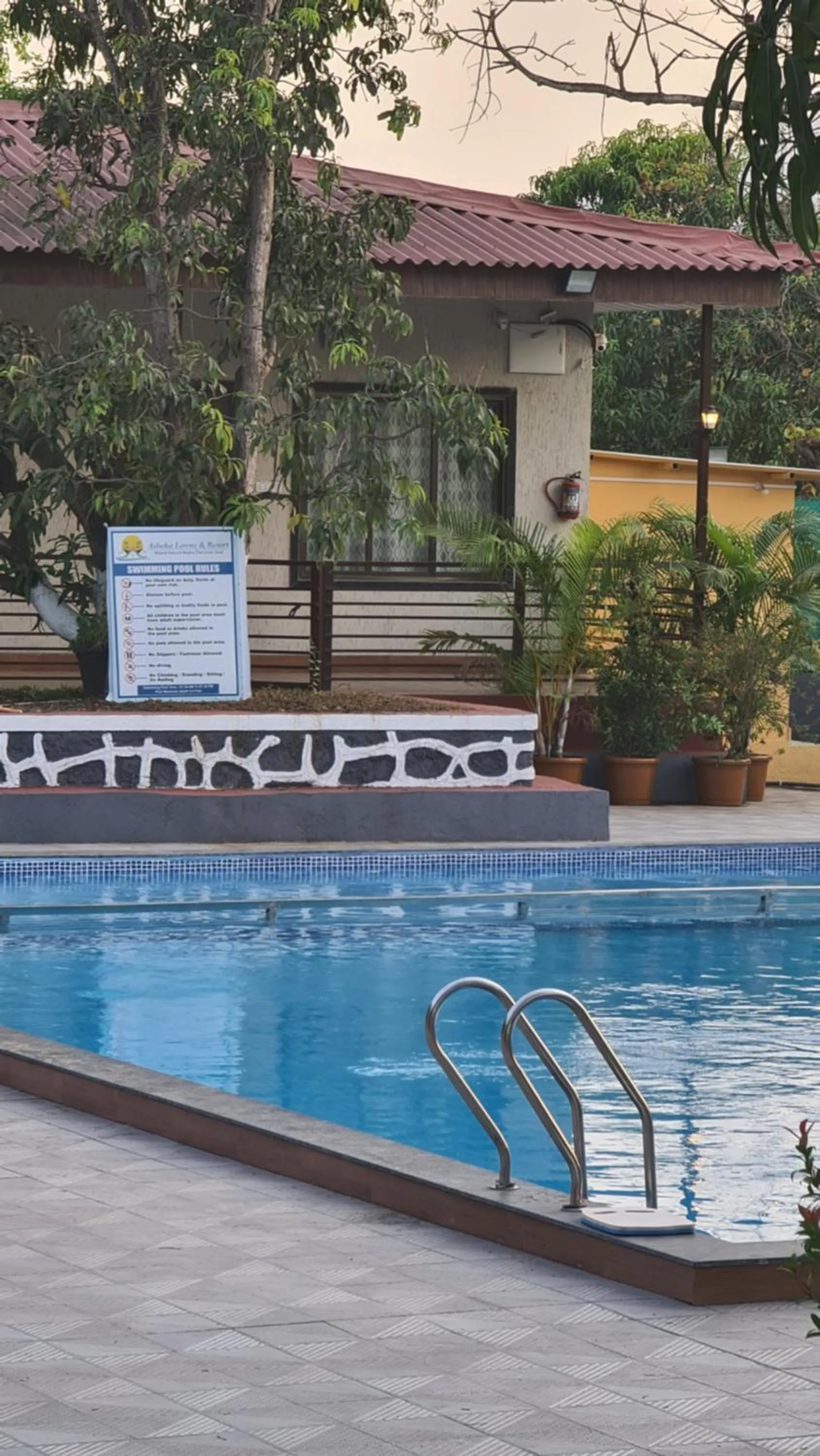 Swimming pool in Ashoka Lawns and Resort