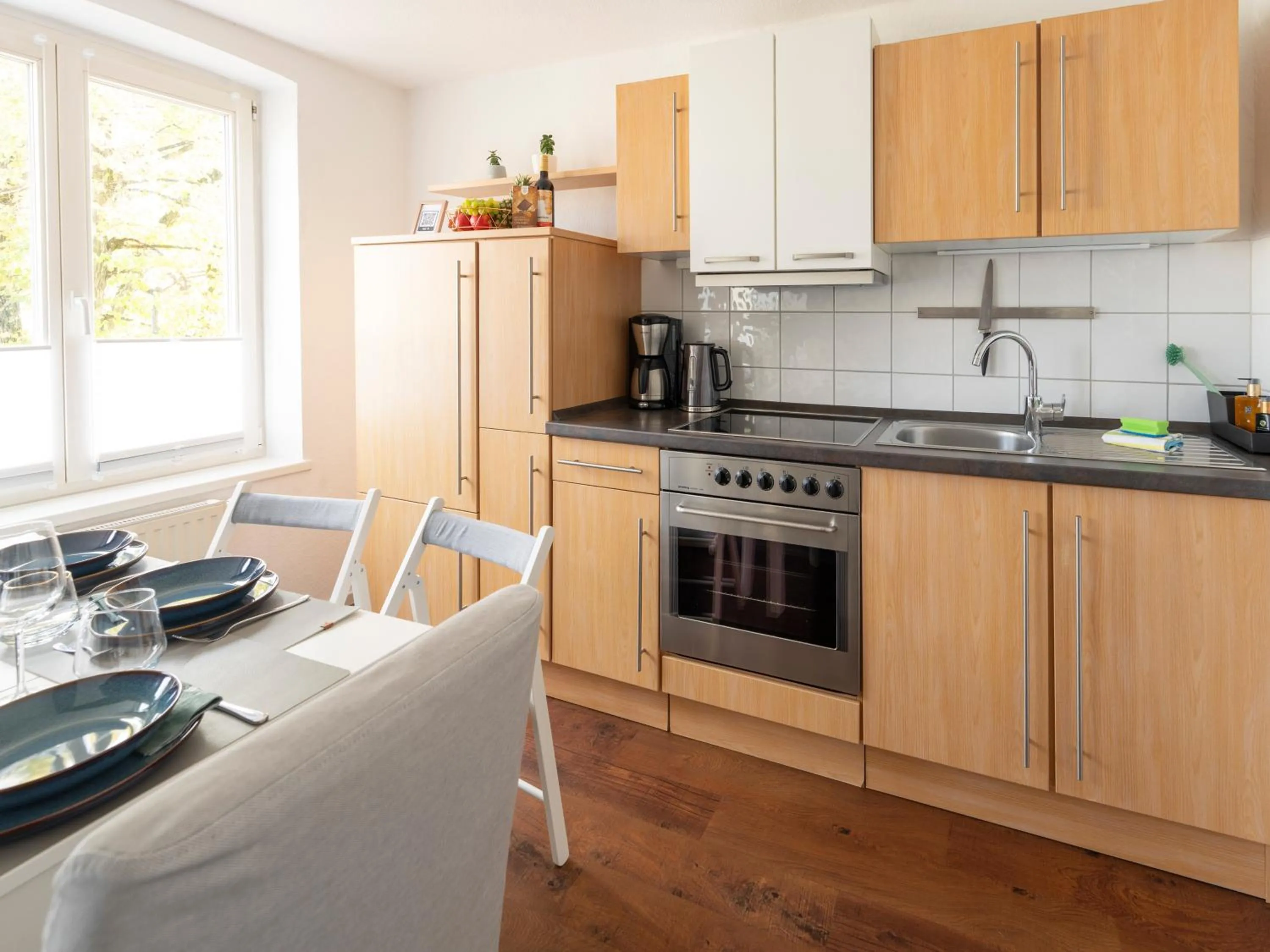 Kitchen or kitchenette in Schlosskönig - Modernes & zentrales Apartment mit Balkon und Arbeitsplatz