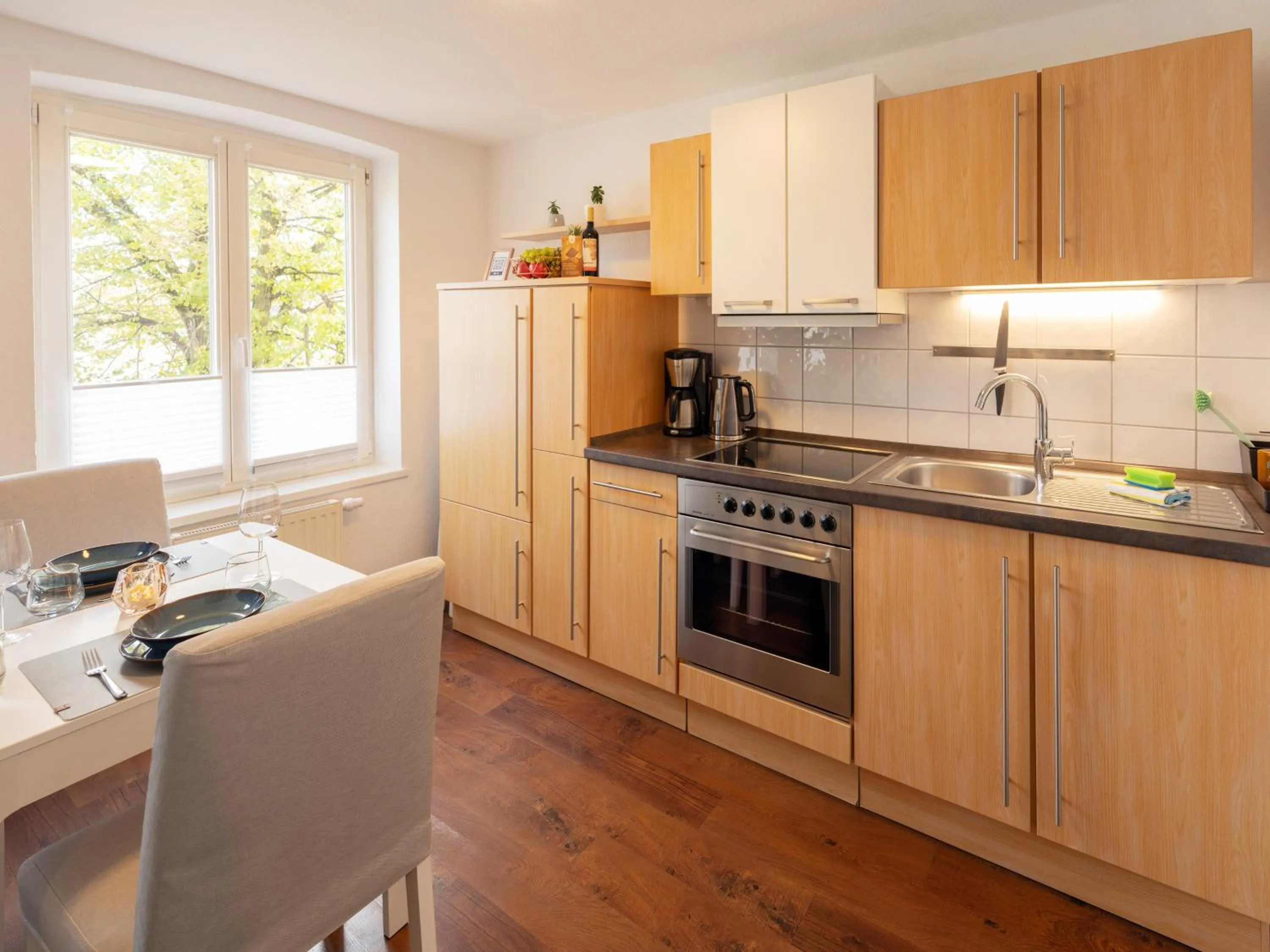 Kitchen or kitchenette in Schlosskönig - Modernes & zentrales Apartment mit Balkon und Arbeitsplatz