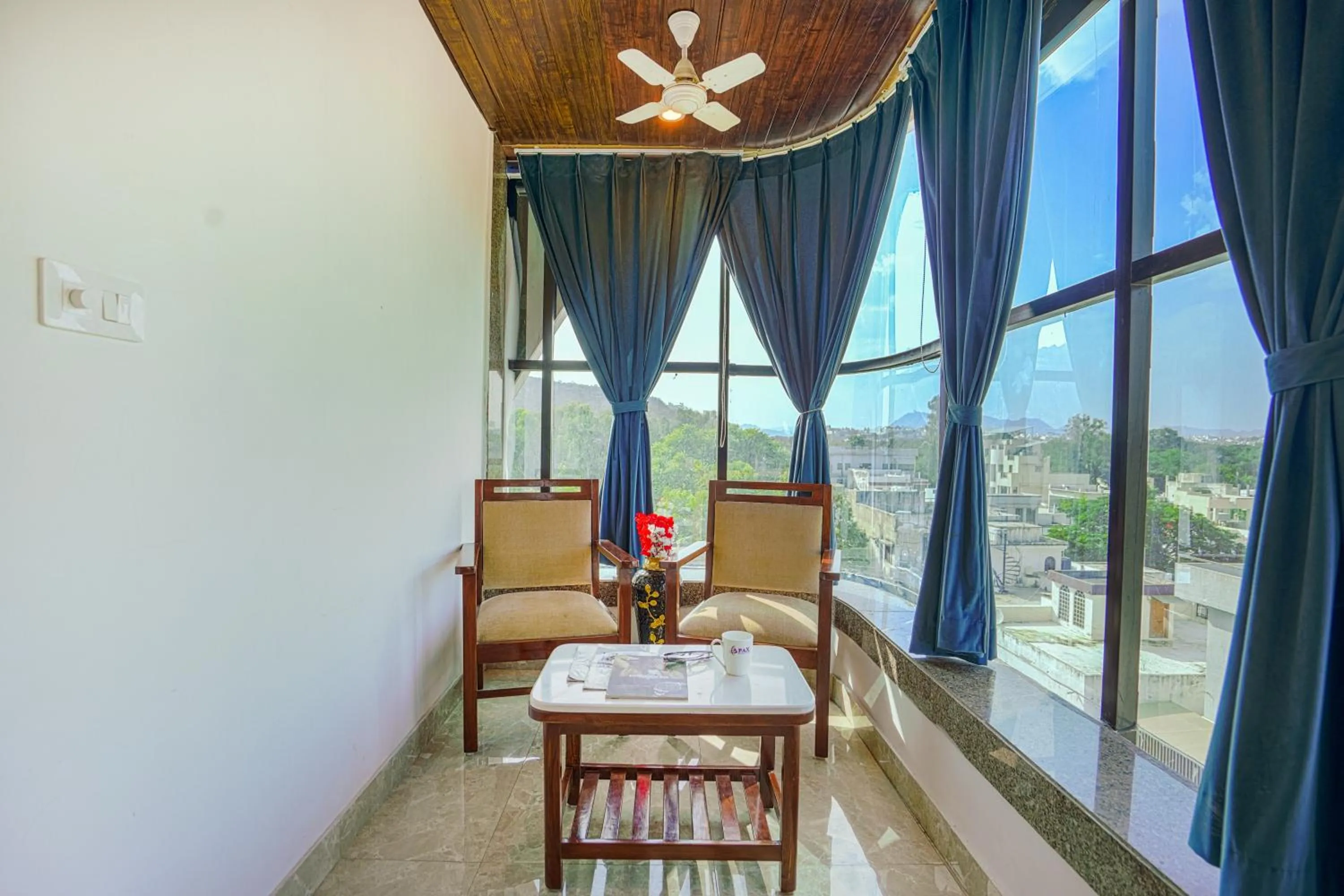 Seating area in Pax Hotel Grand Blue 3 min walk from Udaipur city Railway Station