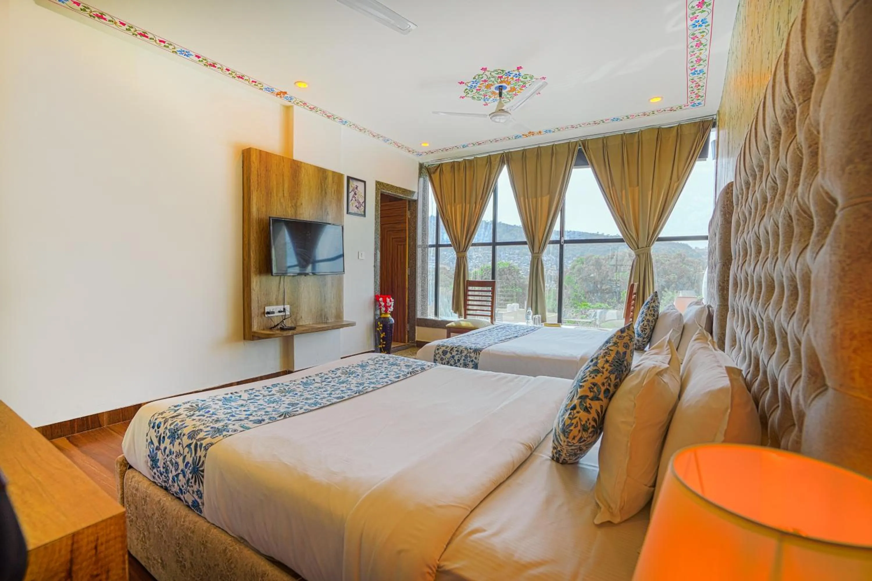 Bedroom, Bed in Pax Hotel Grand Blue 3 min walk from Udaipur city Railway Station