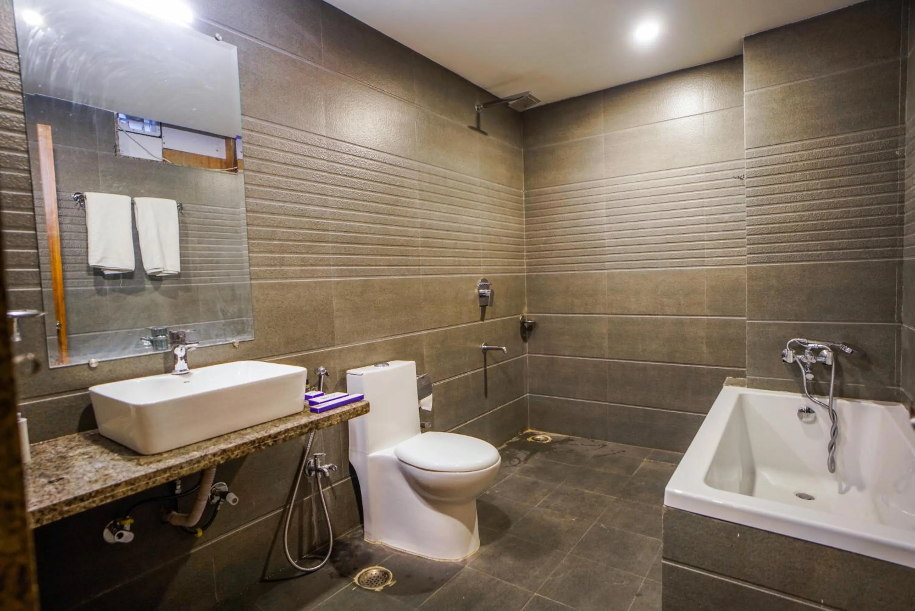 Bathroom in Pax Hotel Grand Blue 3 min walk from Udaipur city Railway Station