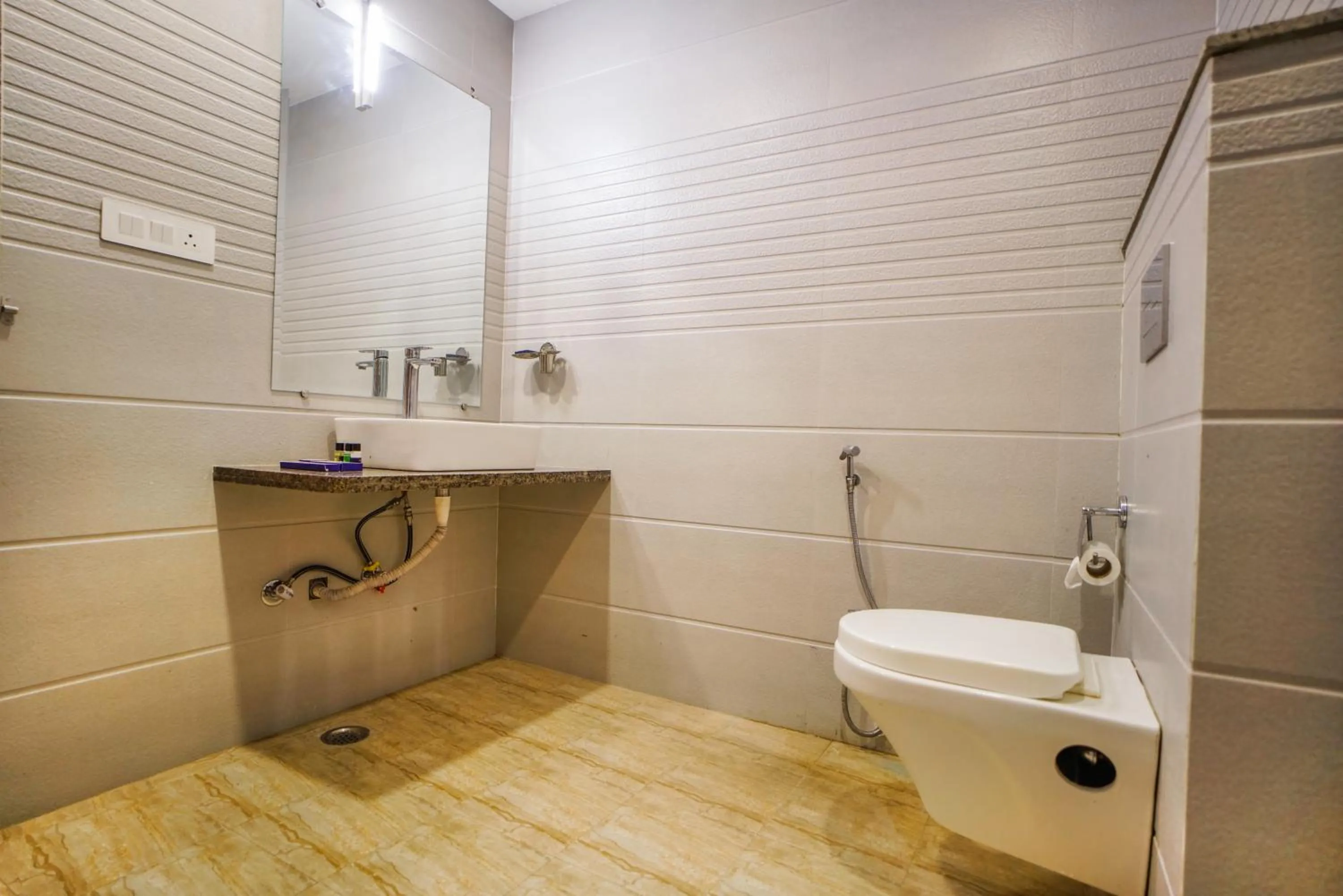 Bathroom in Pax Hotel Grand Blue 3 min walk from Udaipur city Railway Station